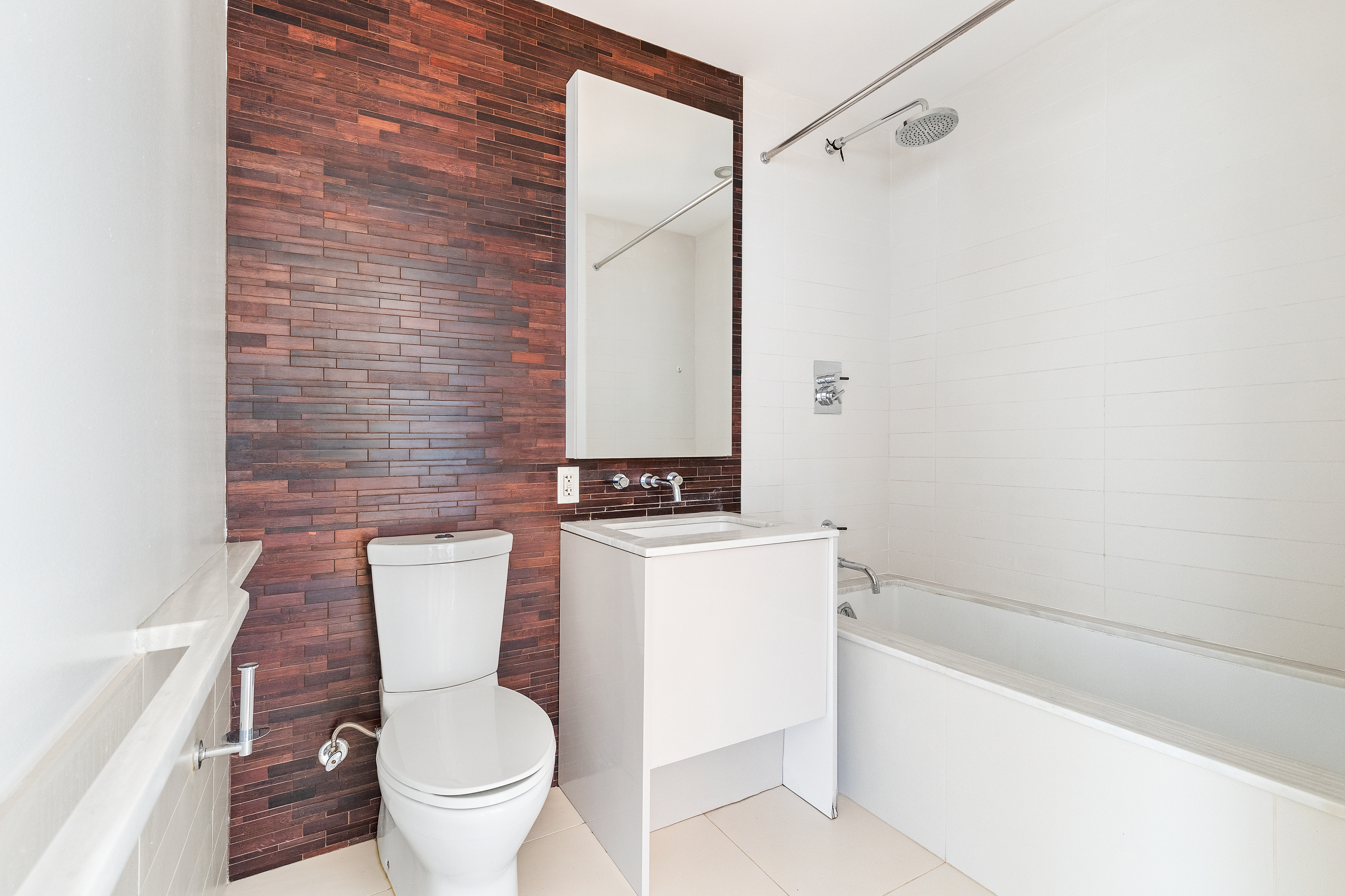 2 Northside Piers, Unit 18E Brooklyn, NY 11249 - Photo 4 of 12 a white toilet sitting next to a bath tub