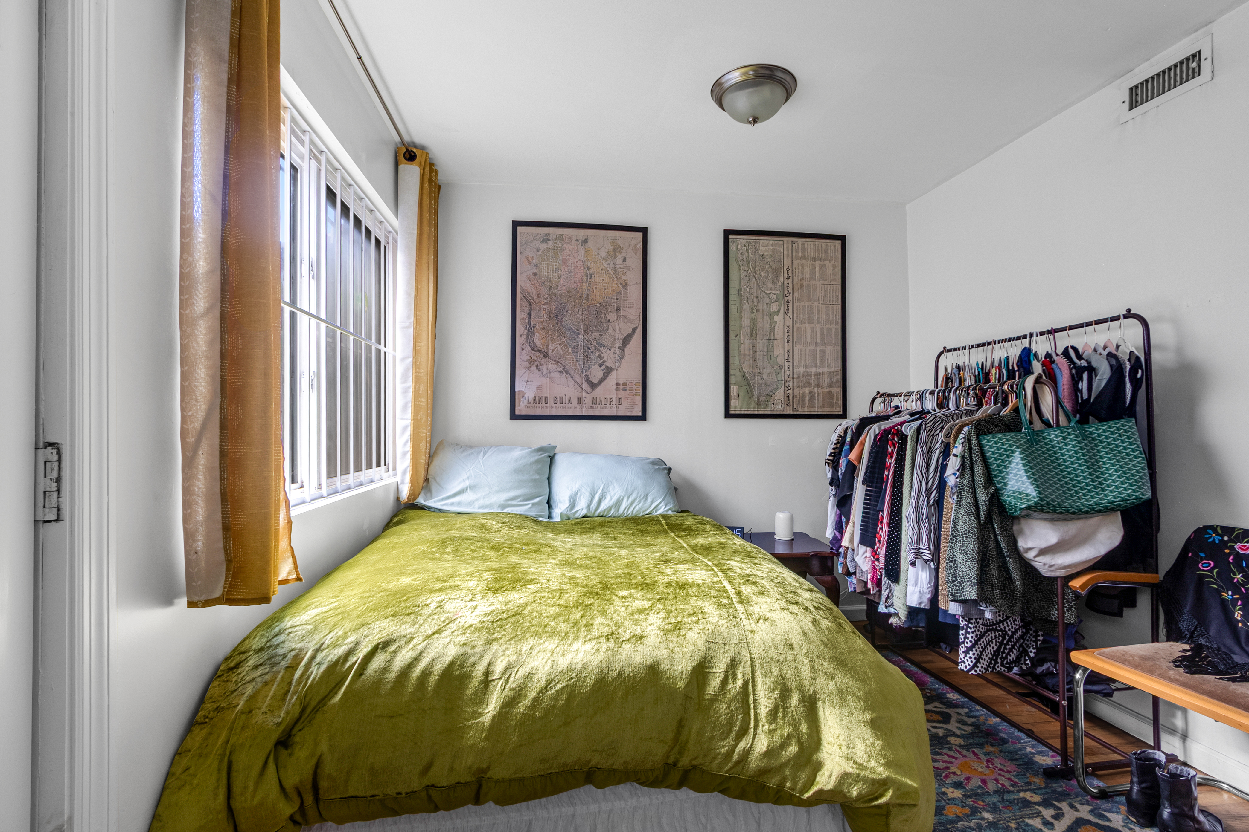 103 A Patchen Avenue Brooklyn, NY 11221 - Photo 6 of 19 a bed sitting in a bedroom next to a window