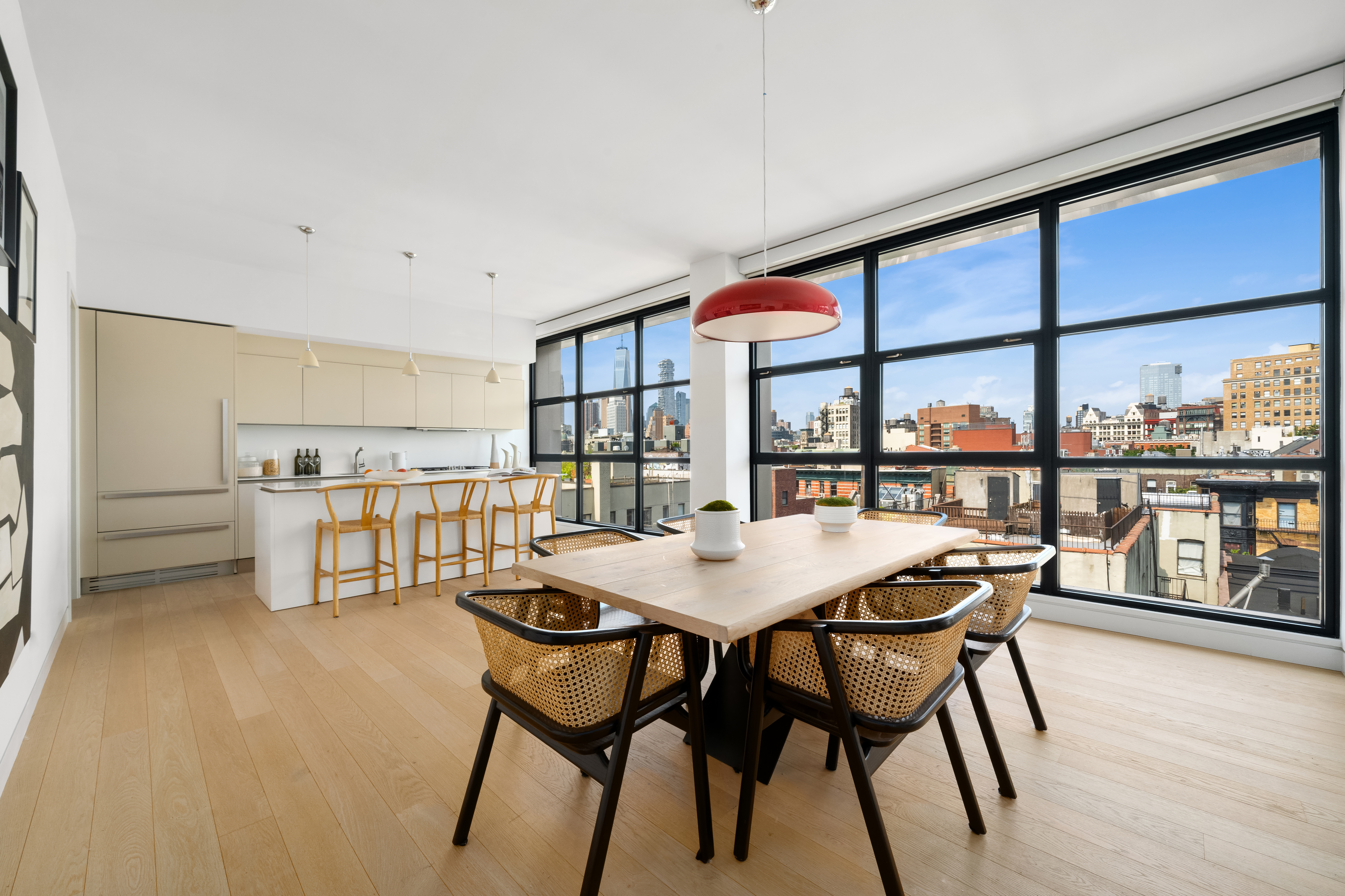 250 Bowery, Unit PHD Manhattan, NY 10012 - Photo 4 of 14 a dining room with furniture and a floor to ceiling window
