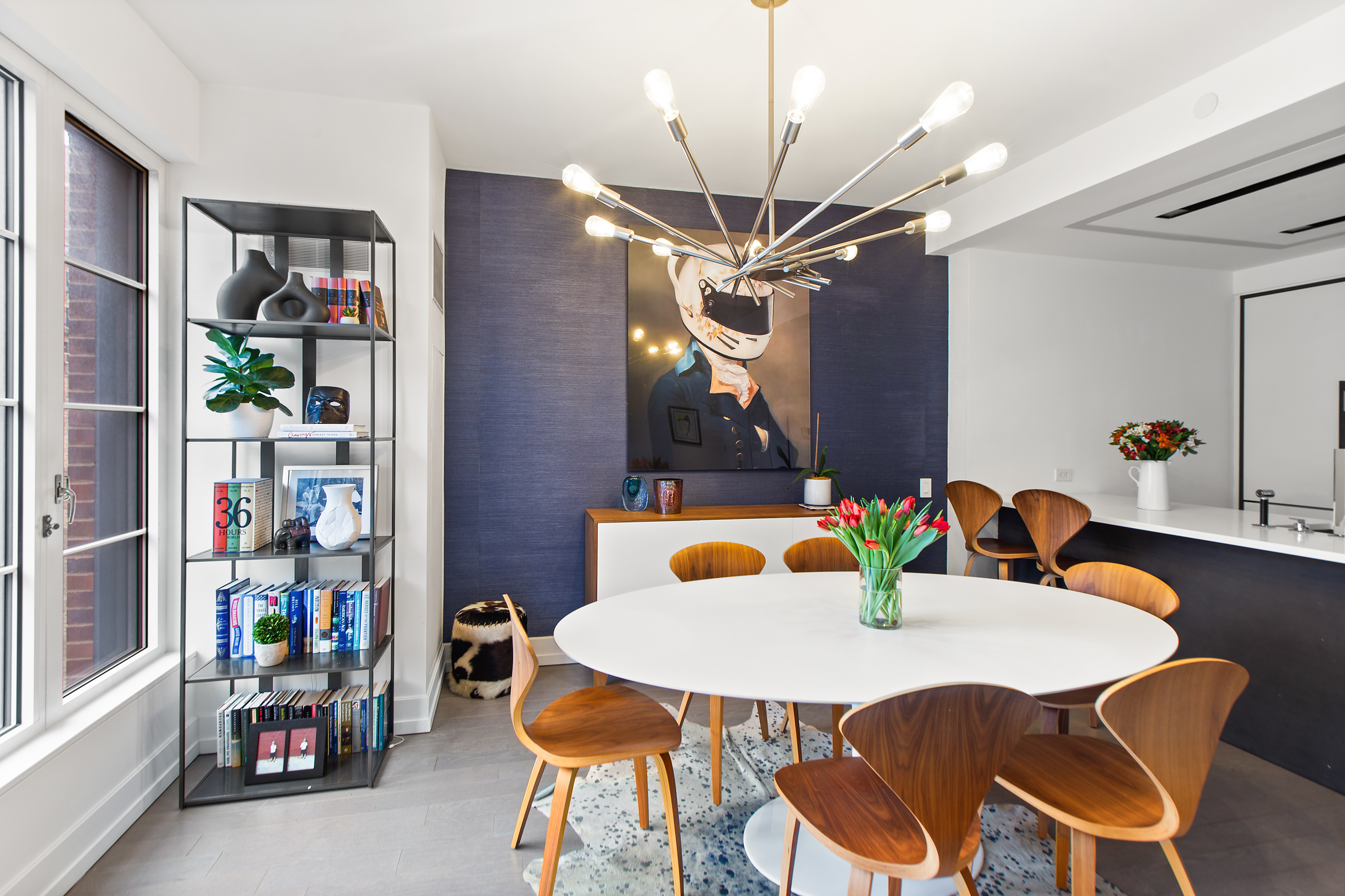 70 Charlton Street, Unit 16C Manhattan, NY 10014 - Photo 5 of 31 a view of a dining room with furniture and a chandelier