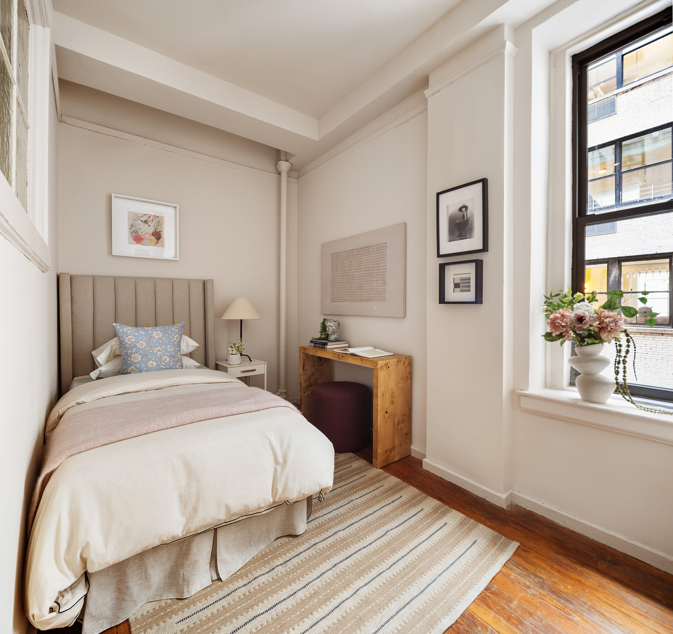 270 Riverside Drive, Unit 2C Manhattan, NY 10025 - Photo 17 of 22 a bedroom with a bed and a window