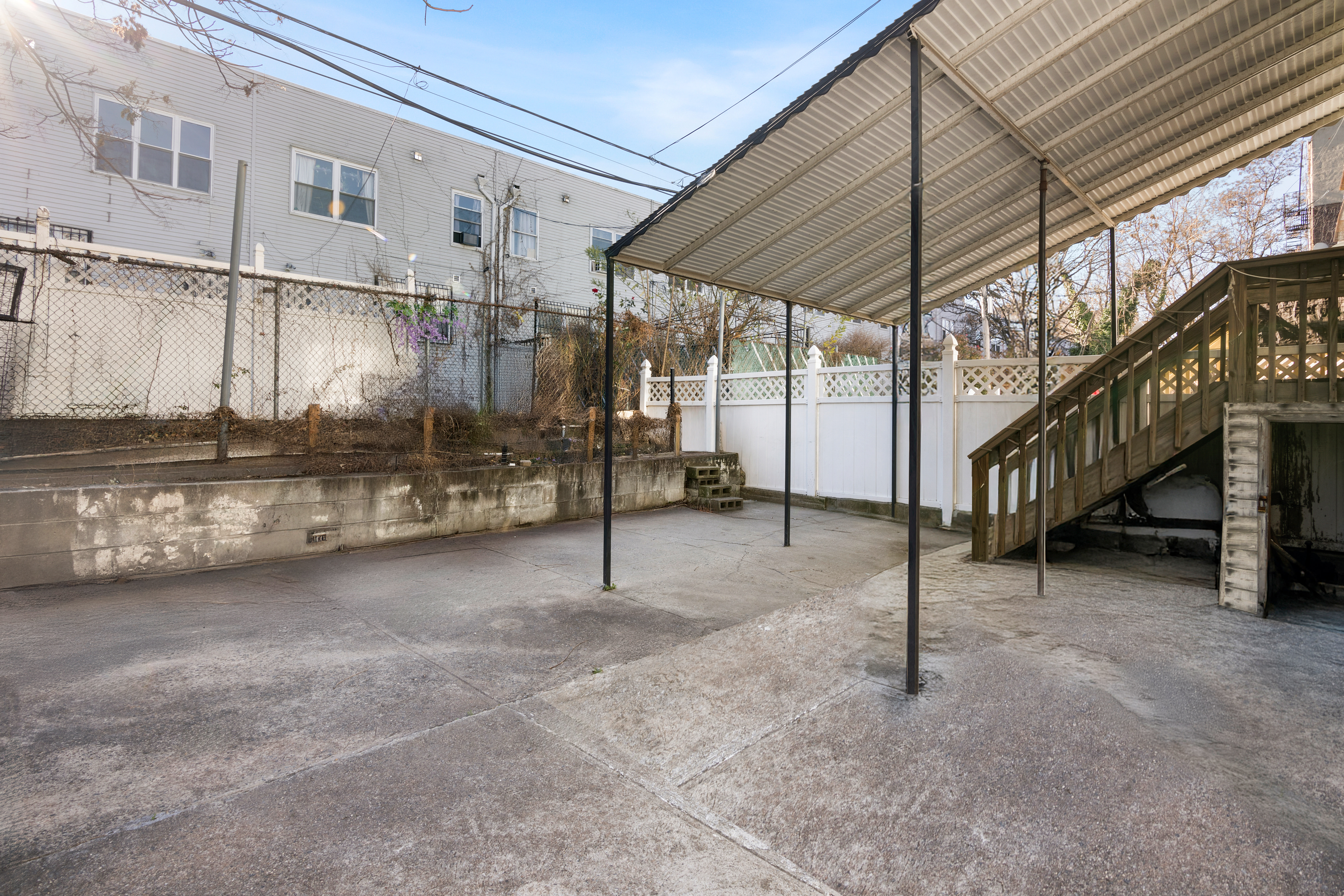 364 Chauncey Street Brooklyn, NY 11233 - Photo 15 of 17 a view of an empty room with stairs