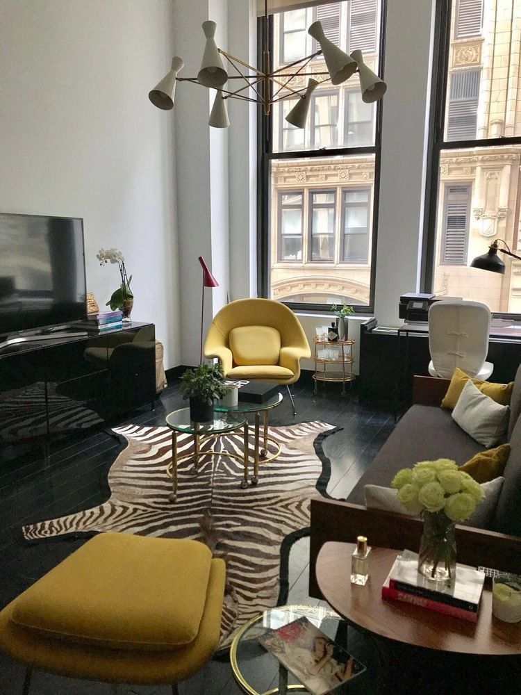 254 Park Avenue South, Unit 4K Manhattan, NY 10010 - Photo 2 of 10 a living room with furniture and a flat screen tv