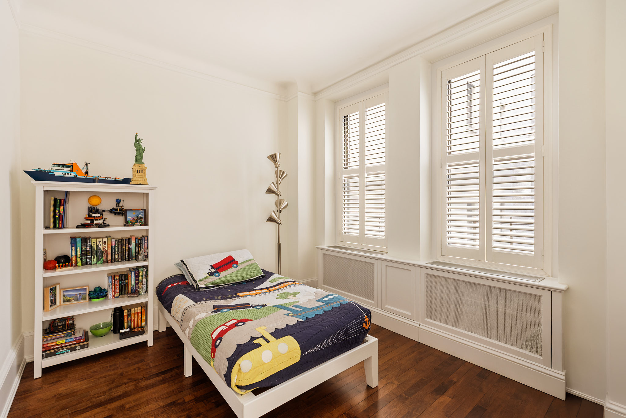 114 East 84th Street, Unit 3D Manhattan, NY 10028 - Photo 7 of 11 a bedroom with a bed and a window