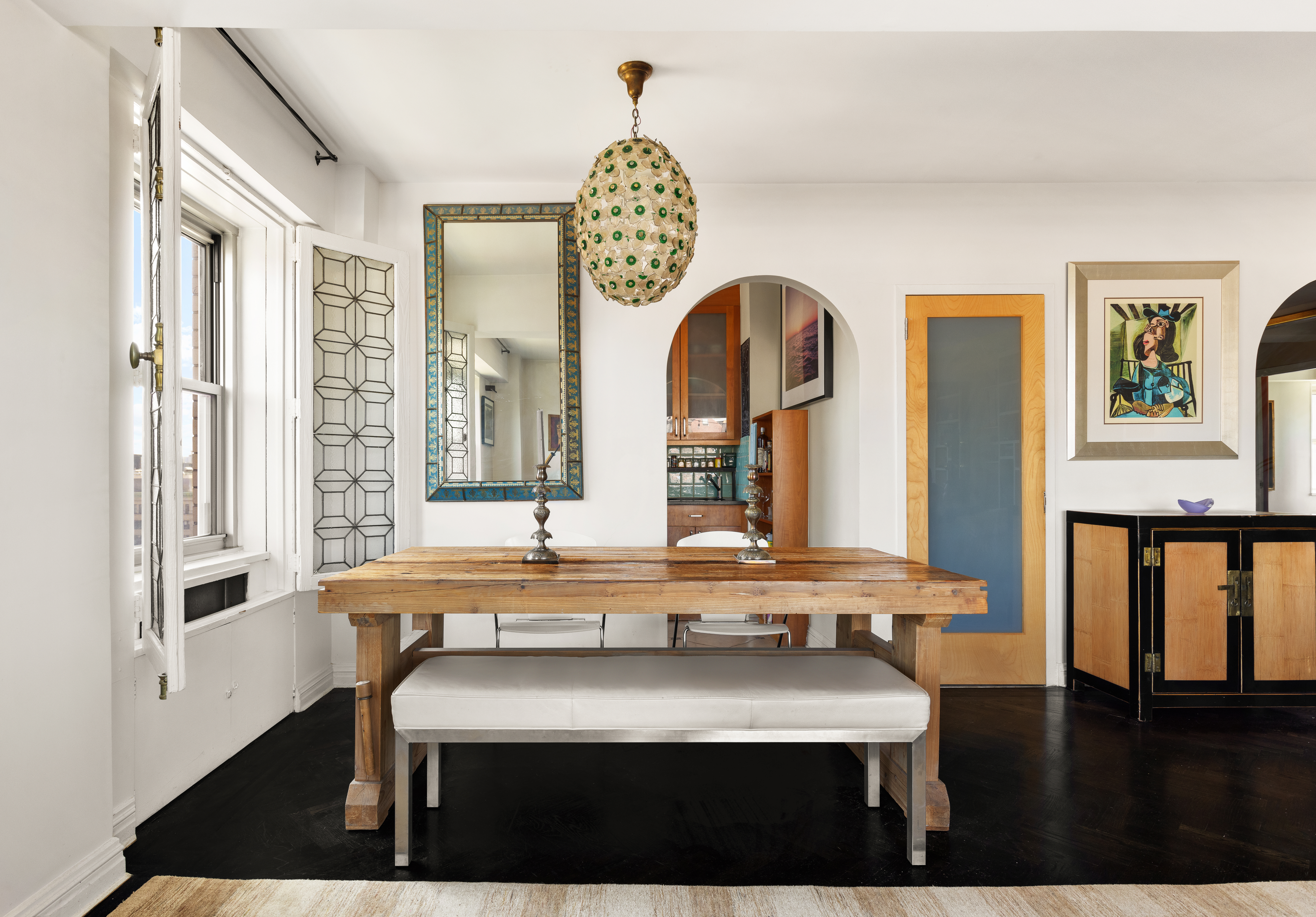 11 5th Avenue, Unit 20N Manhattan, NY 10003 - Photo 5 of 13 a bathroom with a sink a mirror and a window