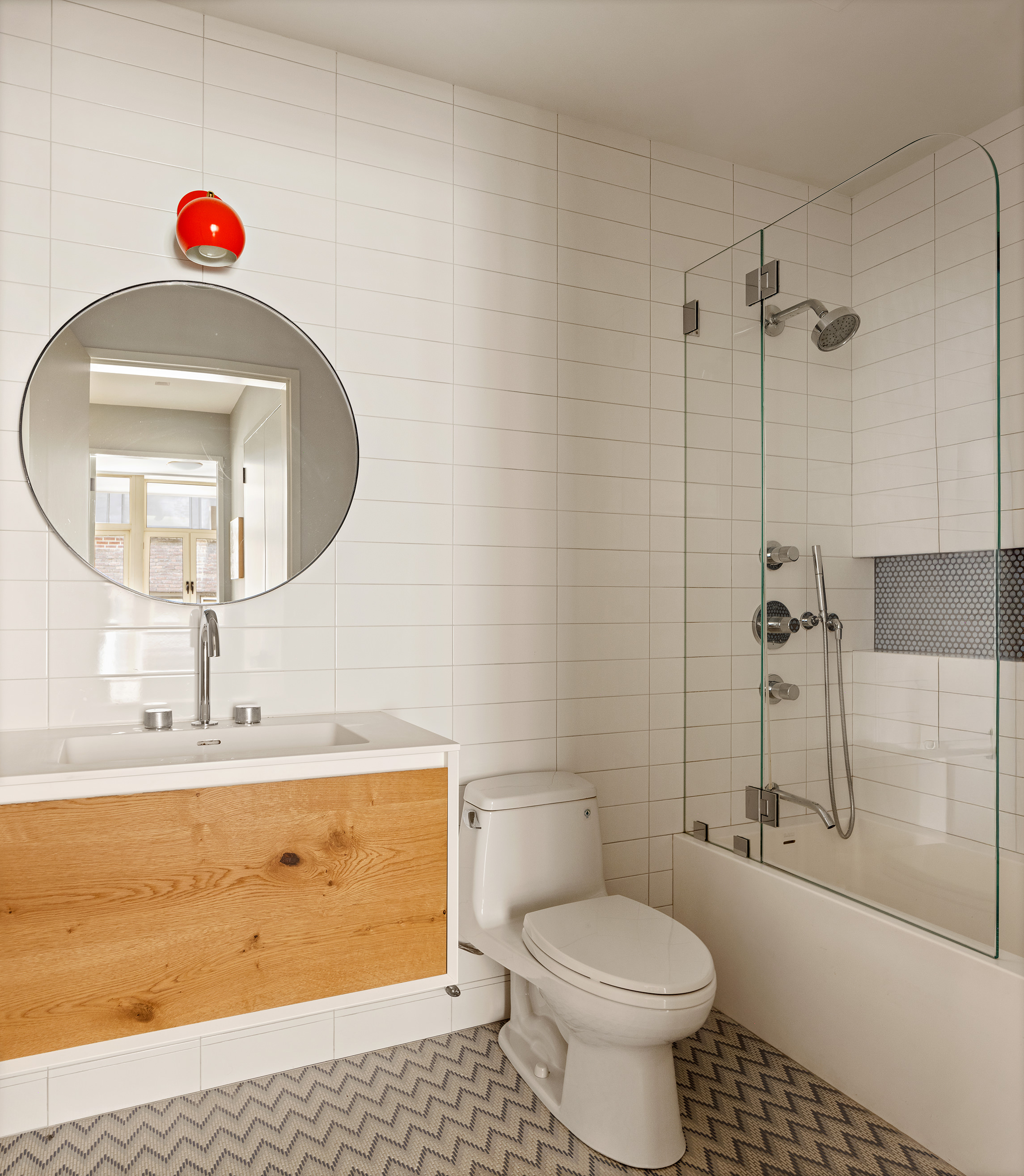 129 West 20th Street, Unit 4B Manhattan, NY 10011 - Photo 13 of 16 a bathroom with a sink a toilet and a mirror