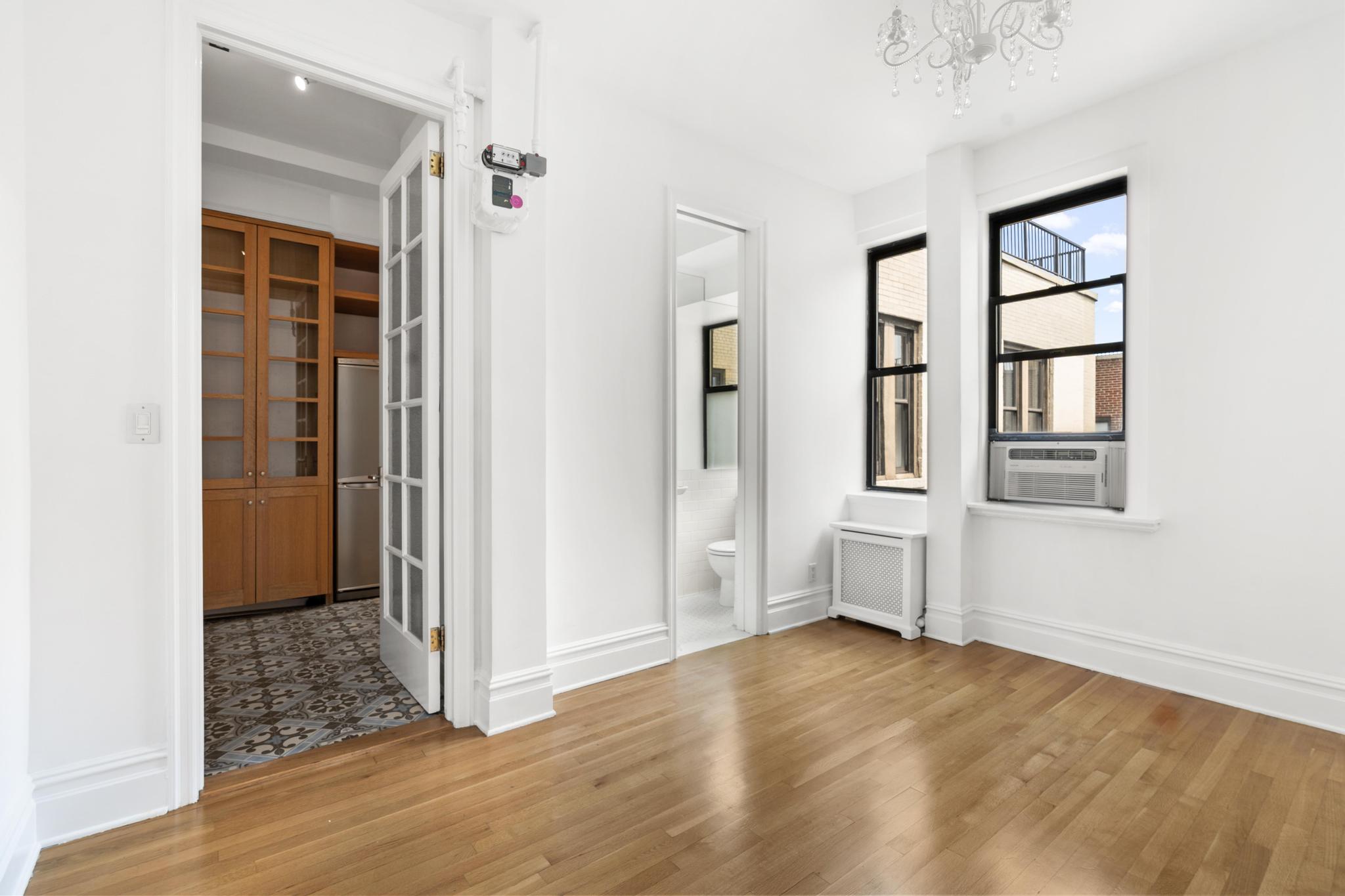 885 West End Avenue, Unit 12D Manhattan, NY 10025 - Photo 17 of 24 an empty room with windows and closet