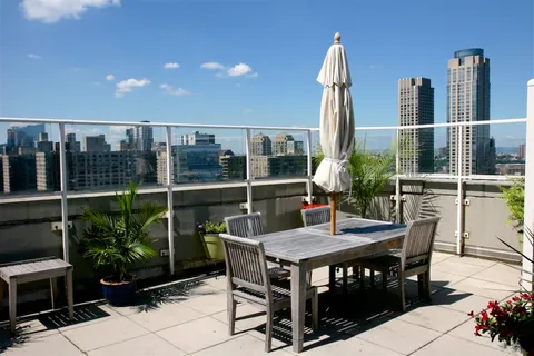 a view of a dinning table and chairs in the patio