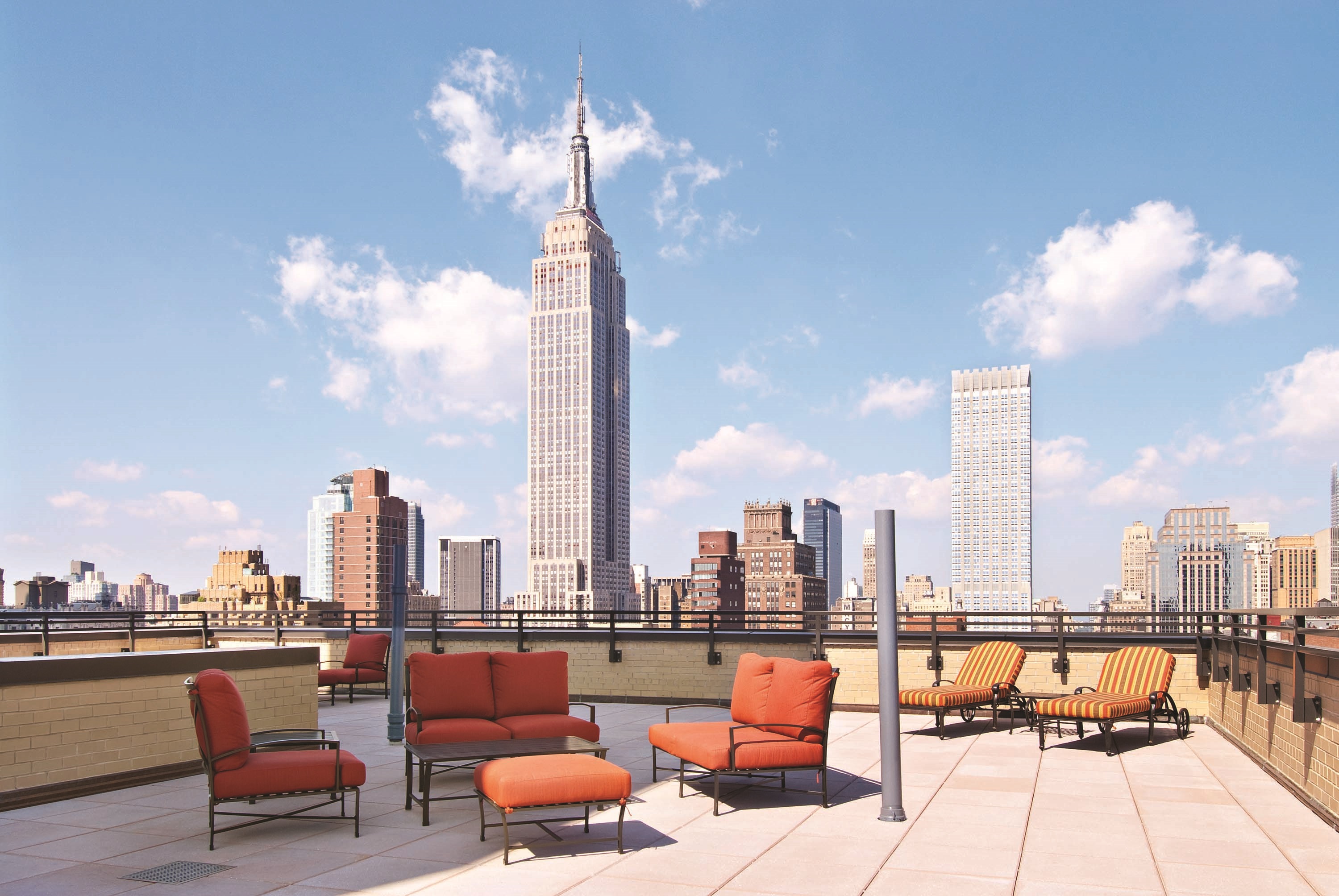 137 East 36th Street, Unit 7H Manhattan, NY 10016 - Photo 10 of 11 a terrace with outdoor seating and city view