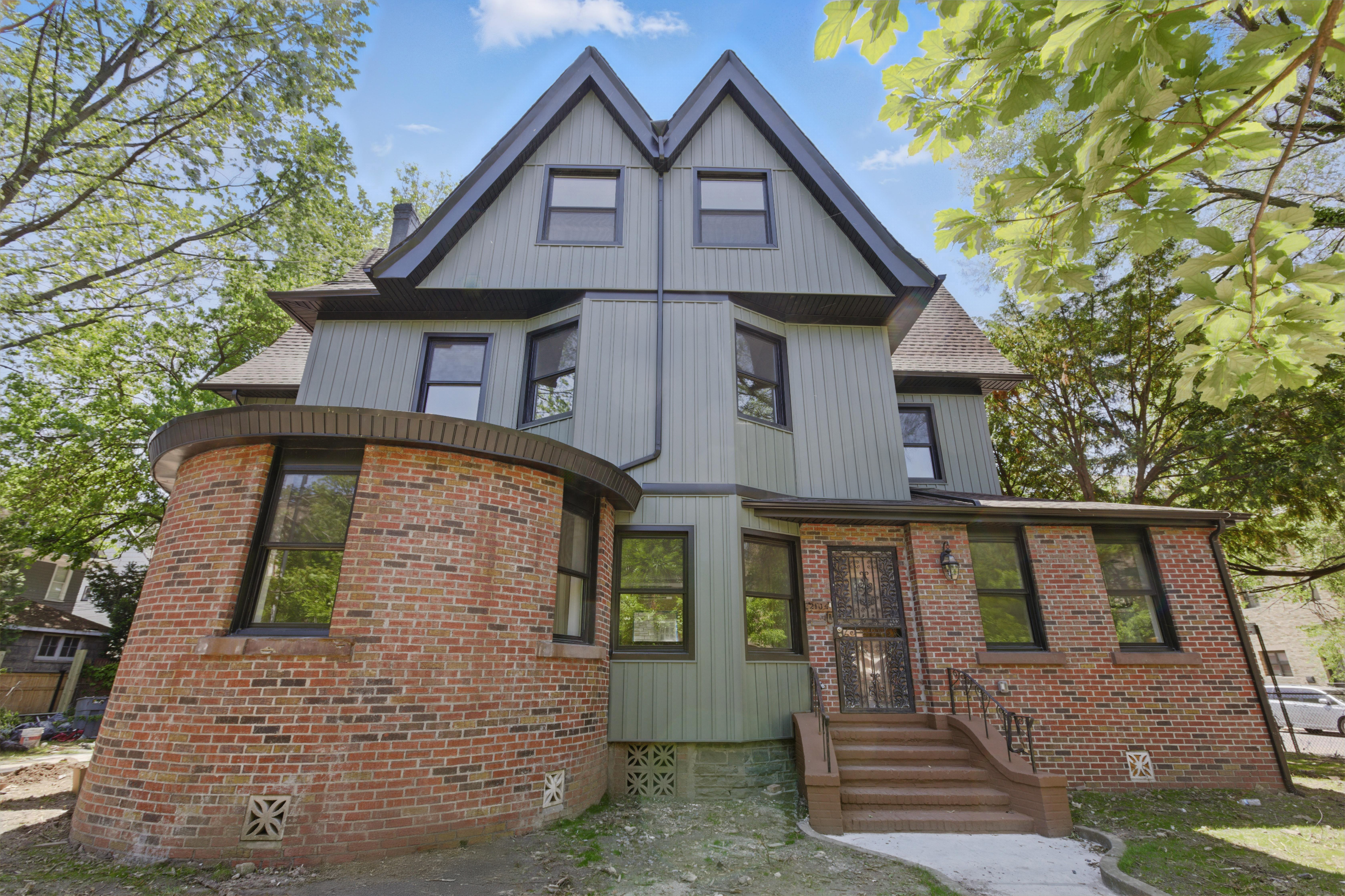 695 East 21st Street Brooklyn, NY 11210 - Photo 2 of 24 a front view of a house with a yard