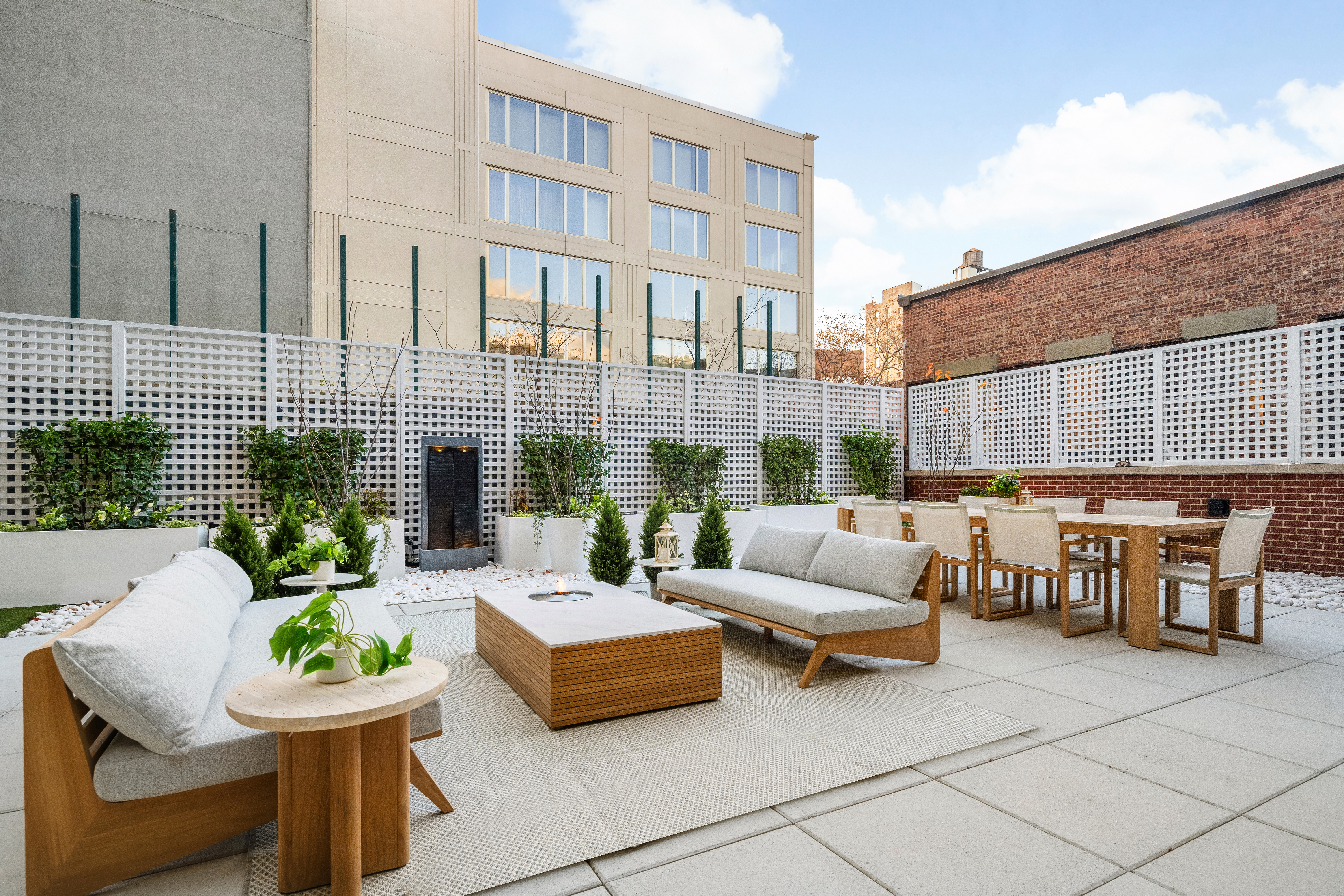 199 Mott Street, Unit 2 Manhattan, NY 10012 - Photo 9 of 14 a view of a patio with couches and a table and chairs
