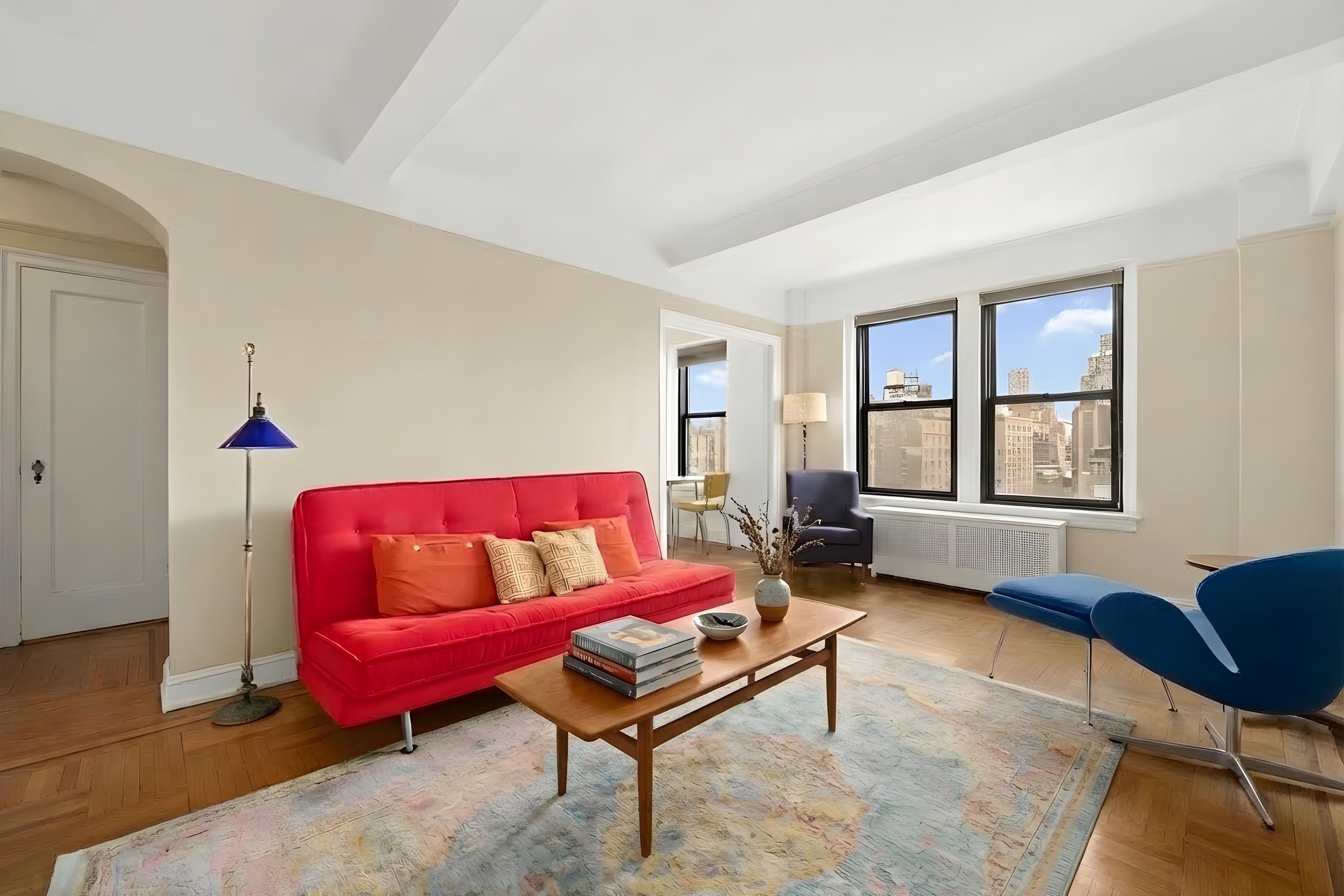 110 West 86th Street, Unit 16C Manhattan, NY 10024 - Photo 1 of 12 a living room with furniture and a window