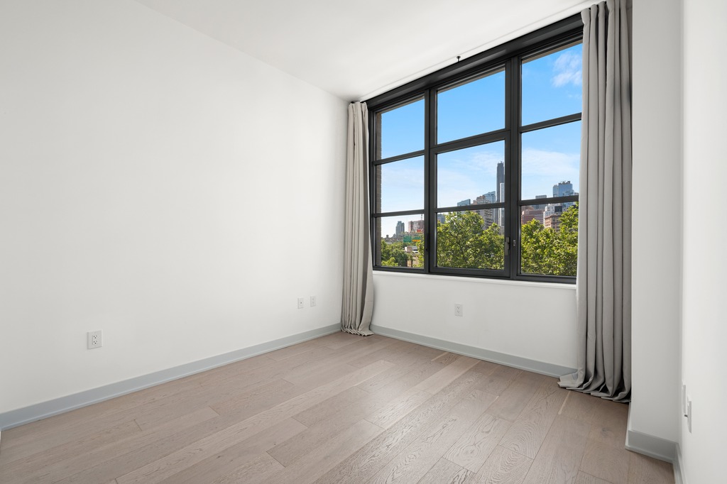 115 York Street, Unit 4J Brooklyn, NY 11201 - Photo 6 of 9 a view of an empty room with a window