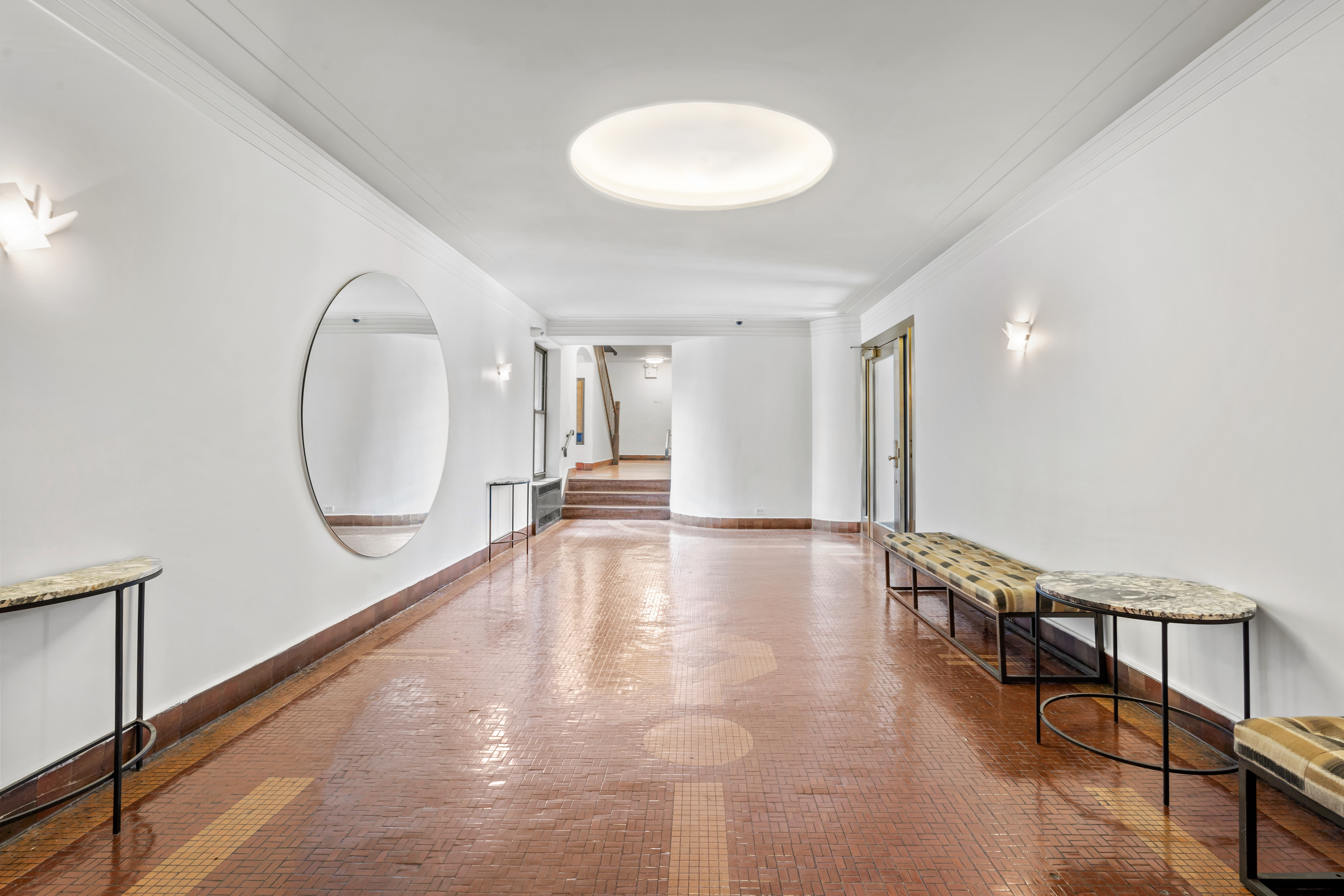 225 West 25th Street, Unit 5D Manhattan, NY 10001 - Photo 10 of 16 a view of a livingroom with wooden floor and a staircase