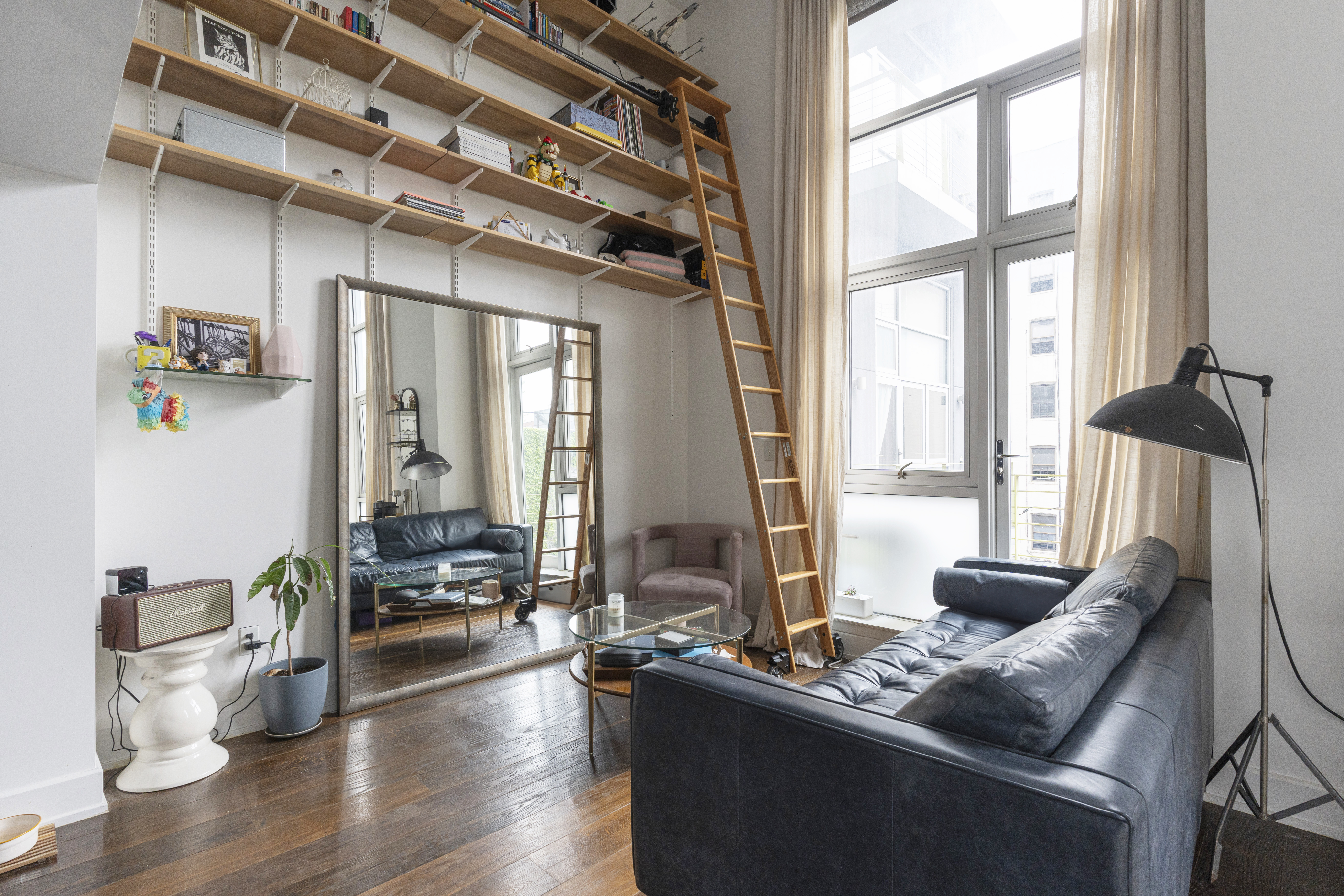 390 Lorimer Street, Unit 3H Brooklyn, NY 11206 - Photo 1 of 13 a living room with furniture and a large window