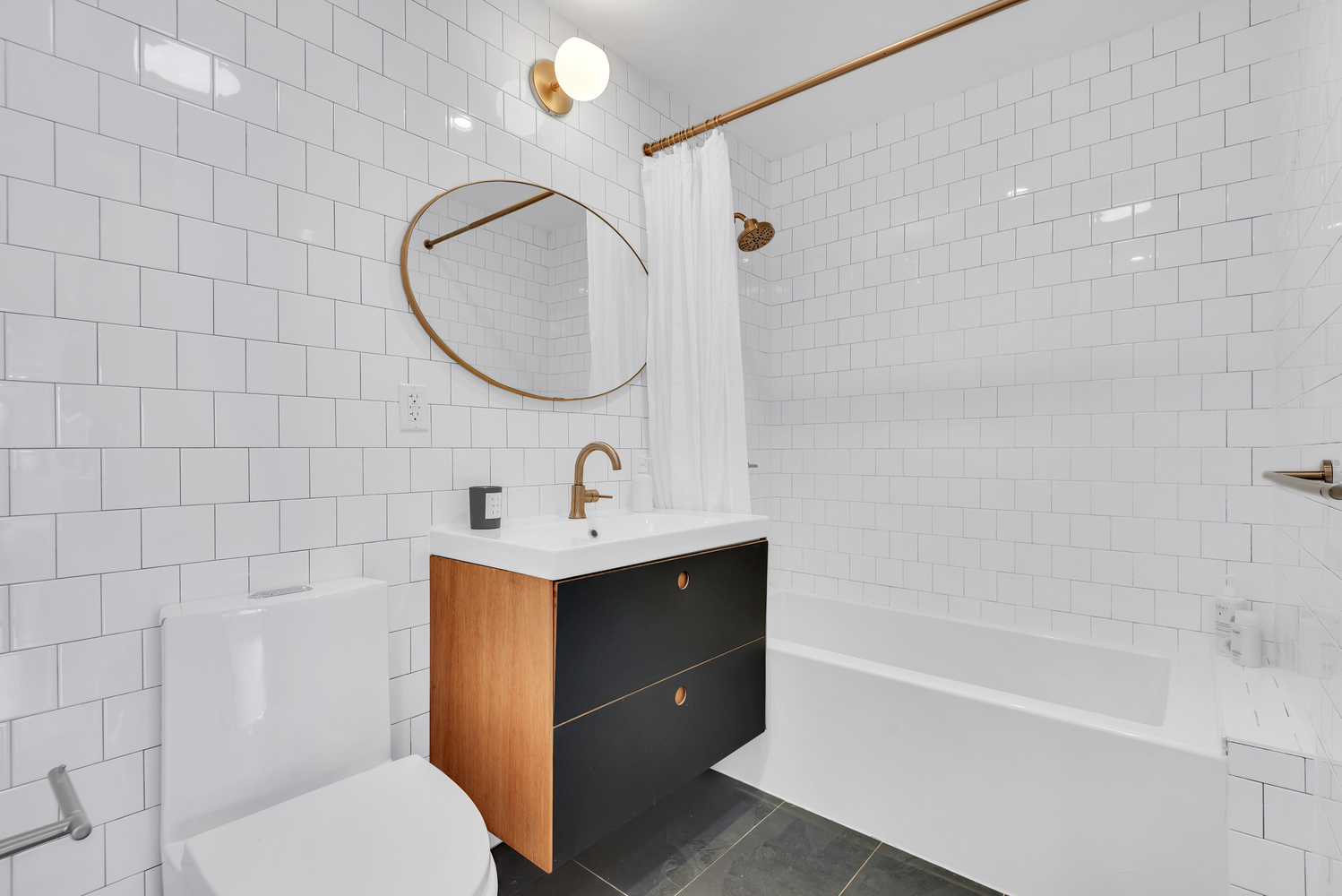 541 Madison Street, Unit 4 Brooklyn, NY 11221 - Photo 8 of 9 a bathroom with a sink a toilet and shower