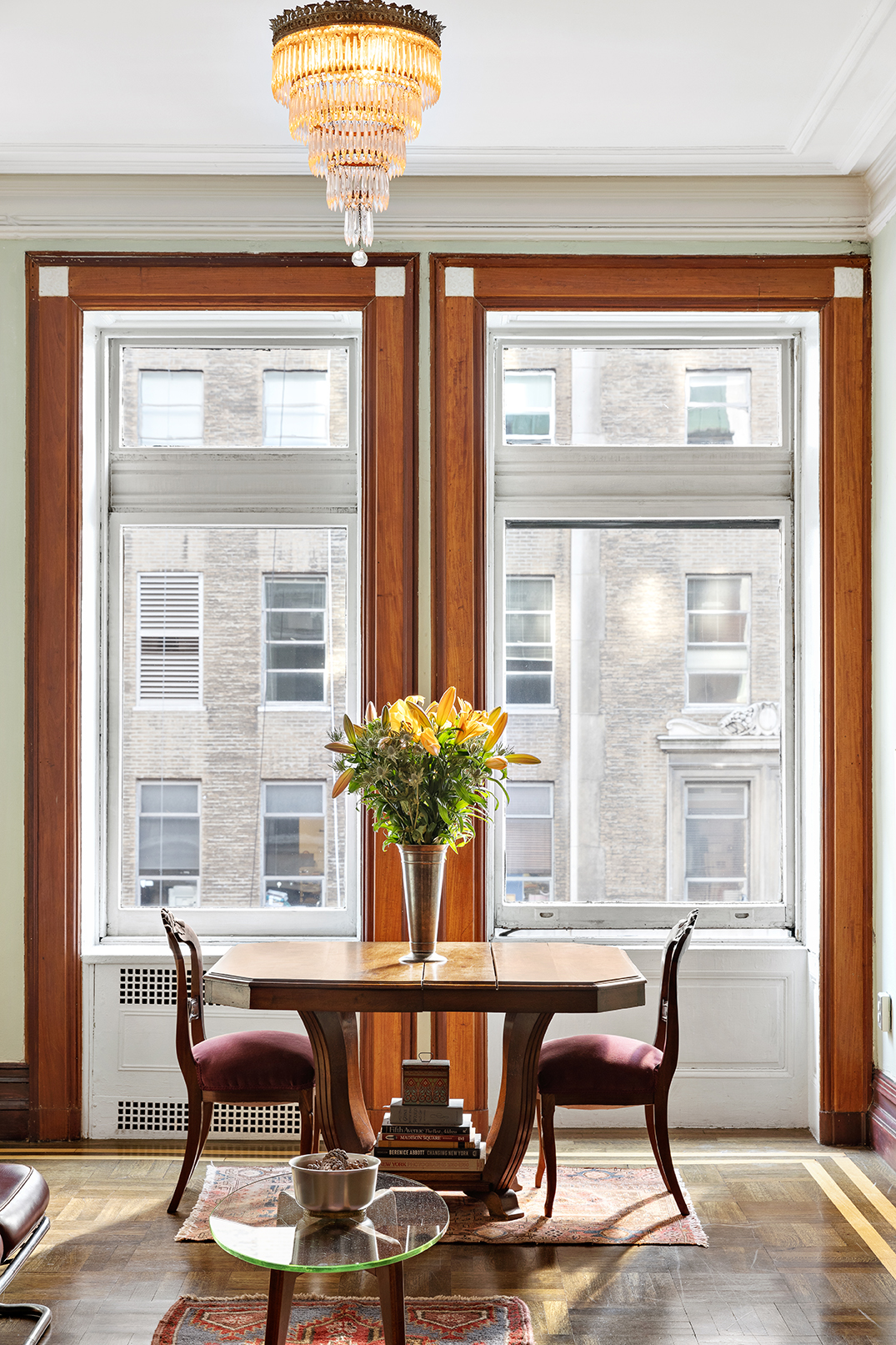 284 5th Avenue, Unit 5F Manhattan, NY 10001 - Photo 2 of 19 a view of a dining room with furniture window and outside view
