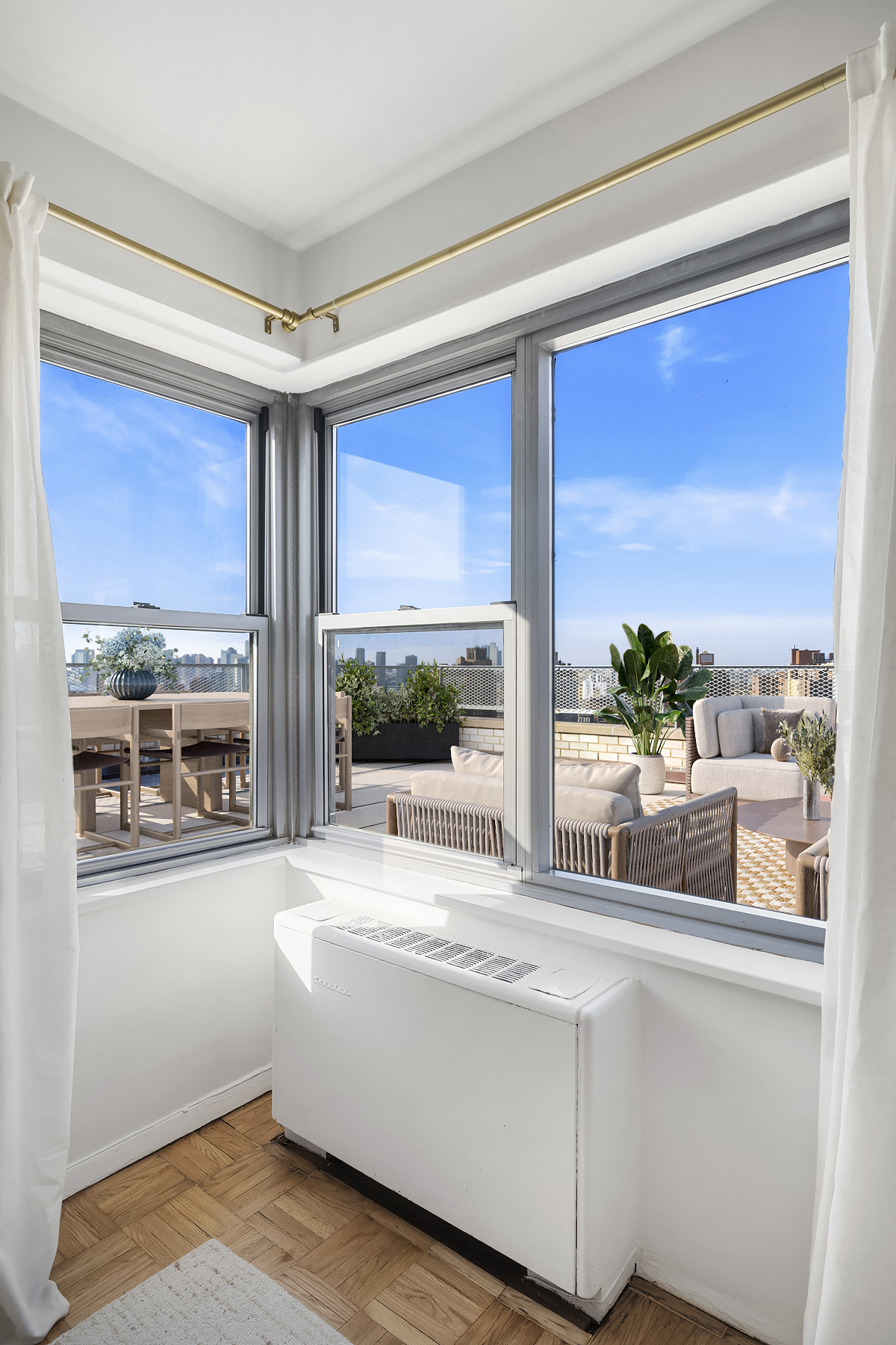 175 West 13th Street, Unit 19C Manhattan, NY 10011 - Photo 9 of 20 a living room with furniture and a large window