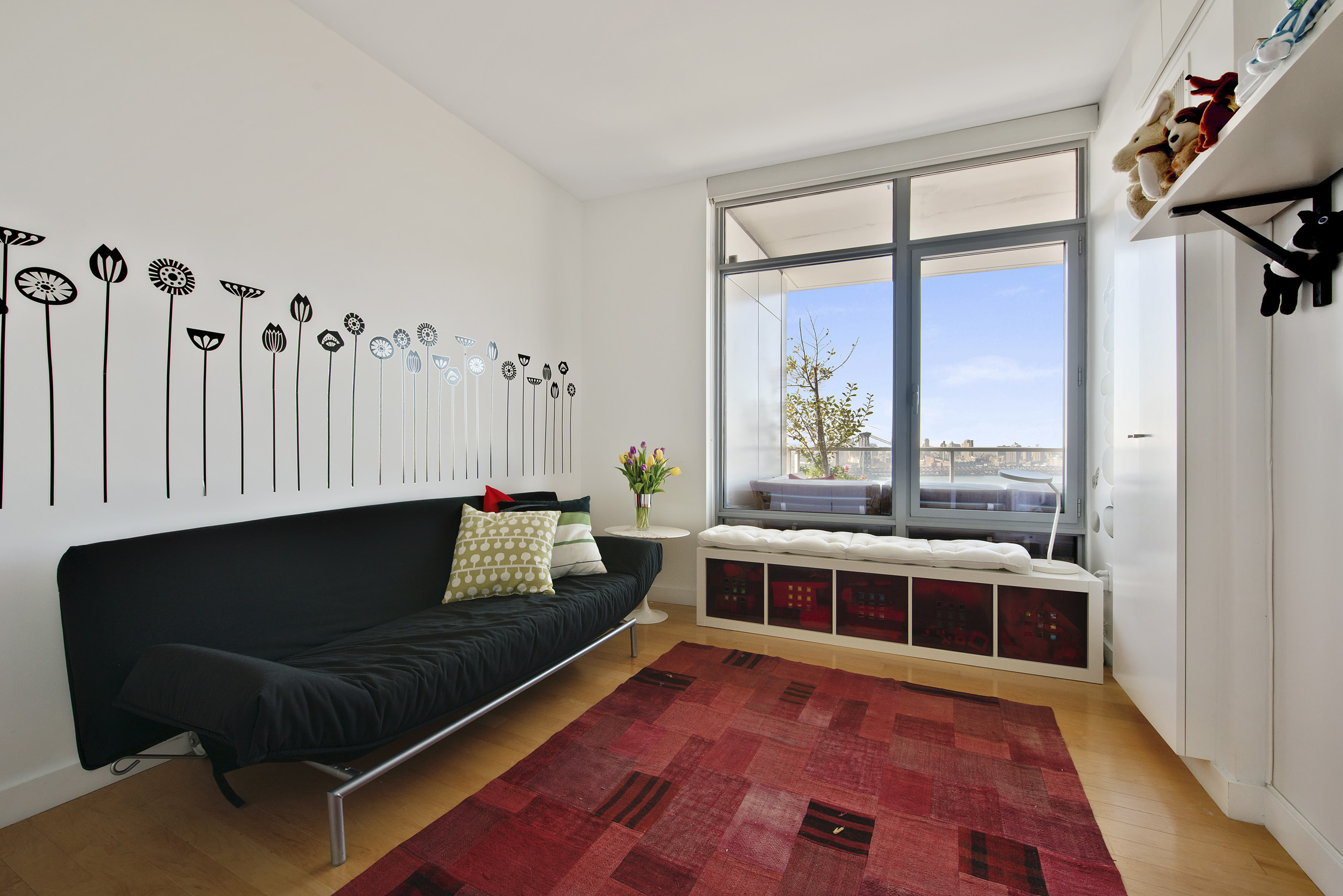 1 Northside Piers, Unit 25D Brooklyn, NY 11249 - Photo 10 of 19 a living room with furniture a rug and a floor to ceiling window