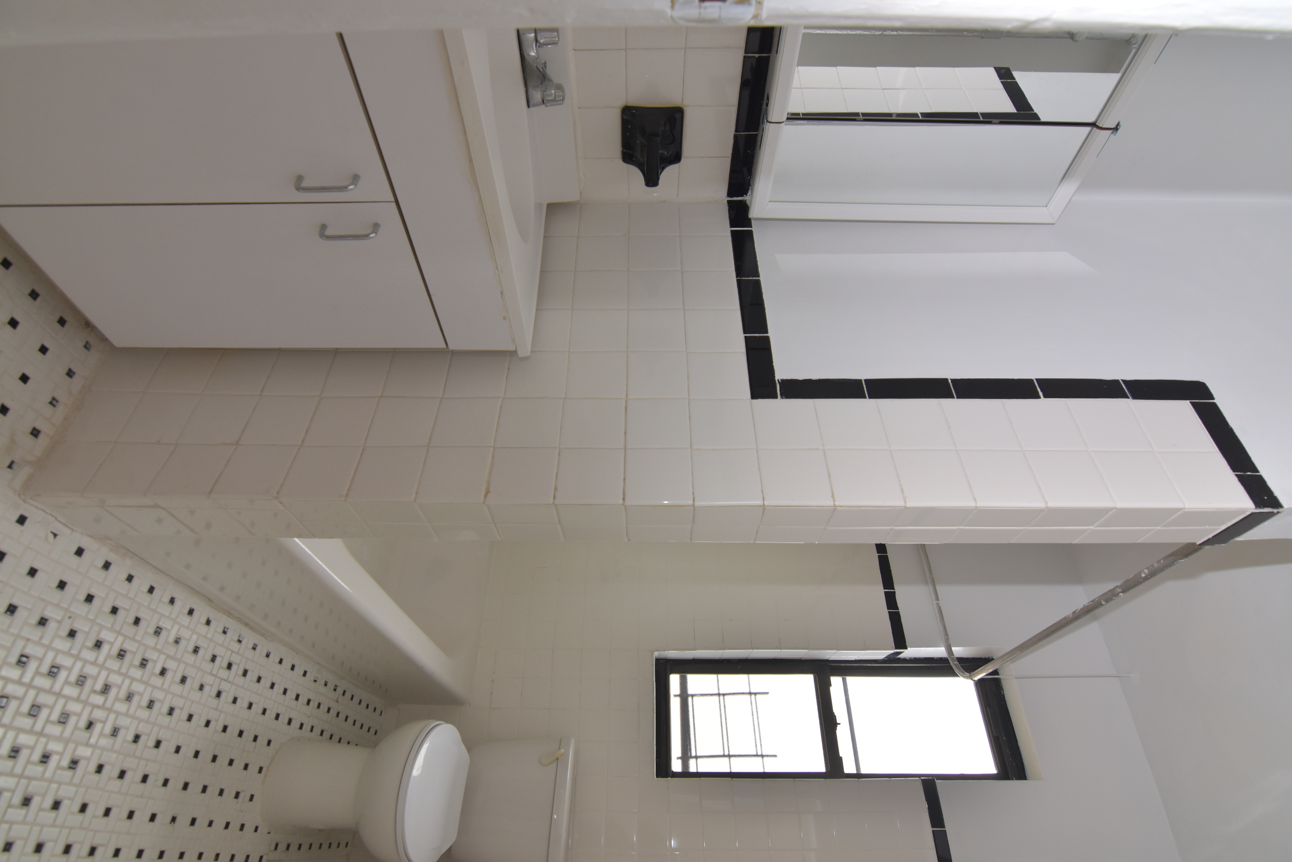20 Laurel Hill Terrace, Unit 6A Manhattan, NY 10033 - Photo 8 of 11 a bathroom with a sink a toilet and a mirror