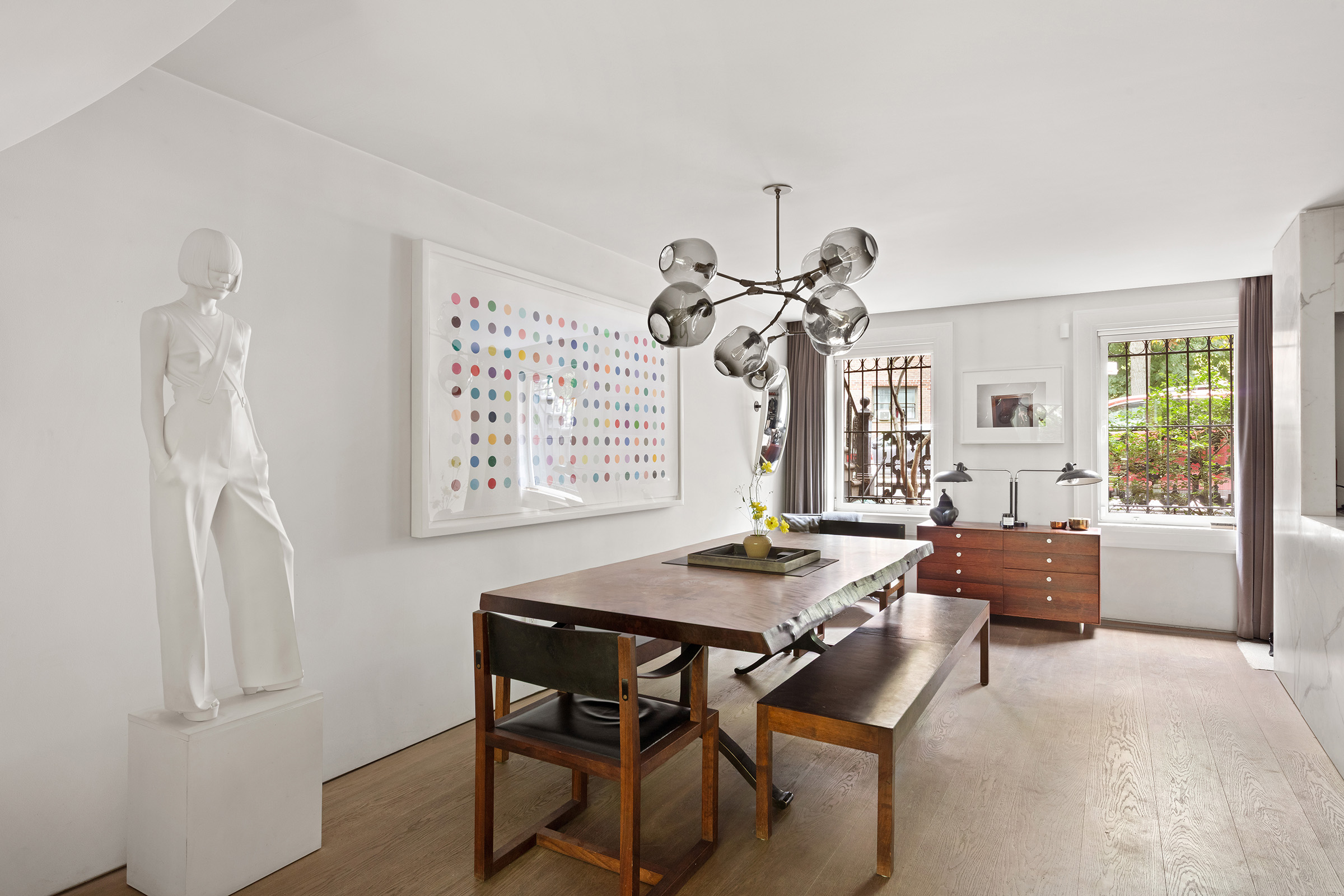 456 West 25th Street Manhattan, NY 10001 - Photo 5 of 22 a view of a dining room with furniture window and outside view