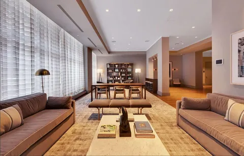 a living room with furniture and a rug