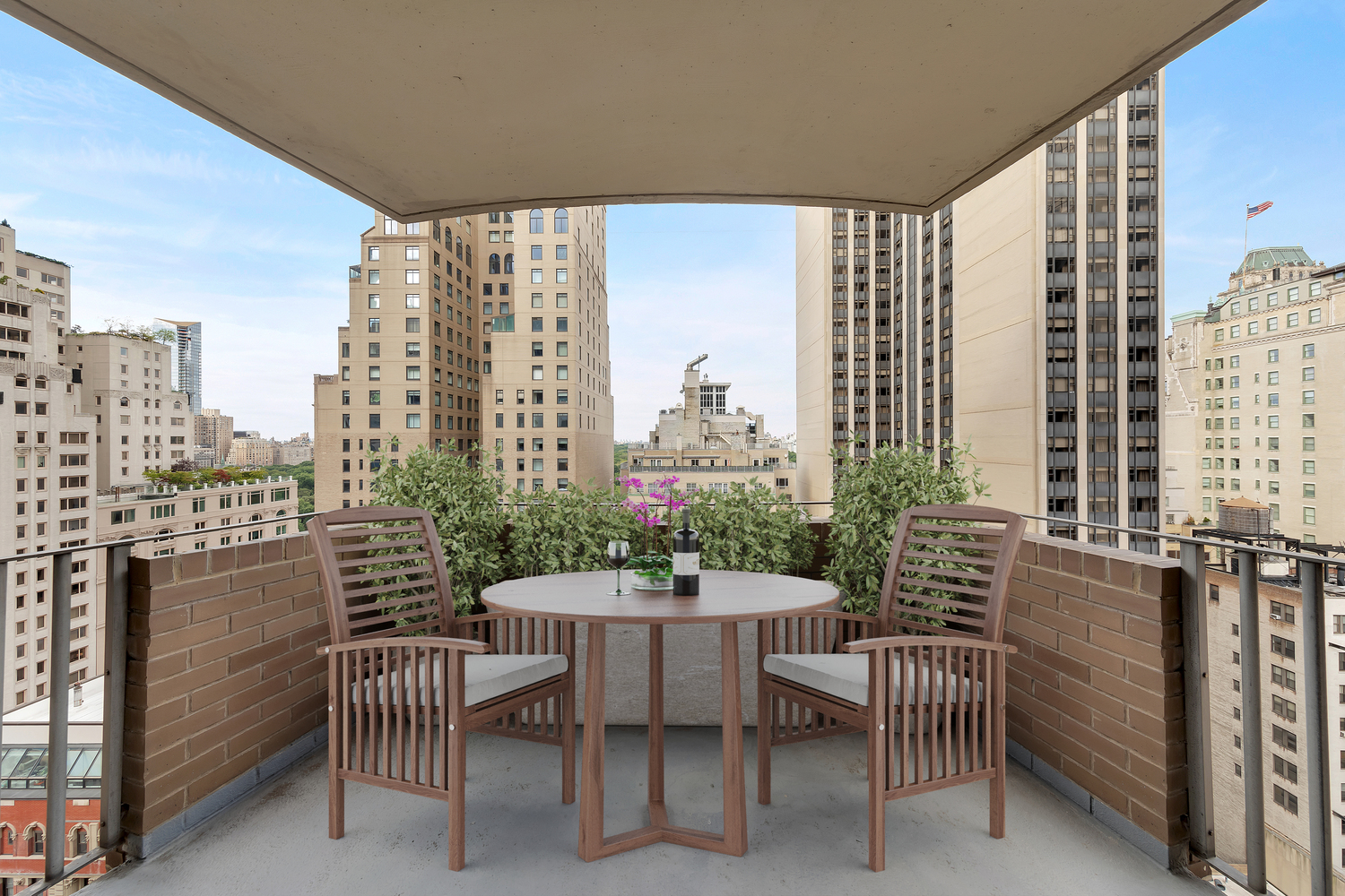 58 West 58th Street, Unit 21C Manhattan, NY 10019 - Photo 1 of 12 a dining room with furniture and a floor to ceiling window