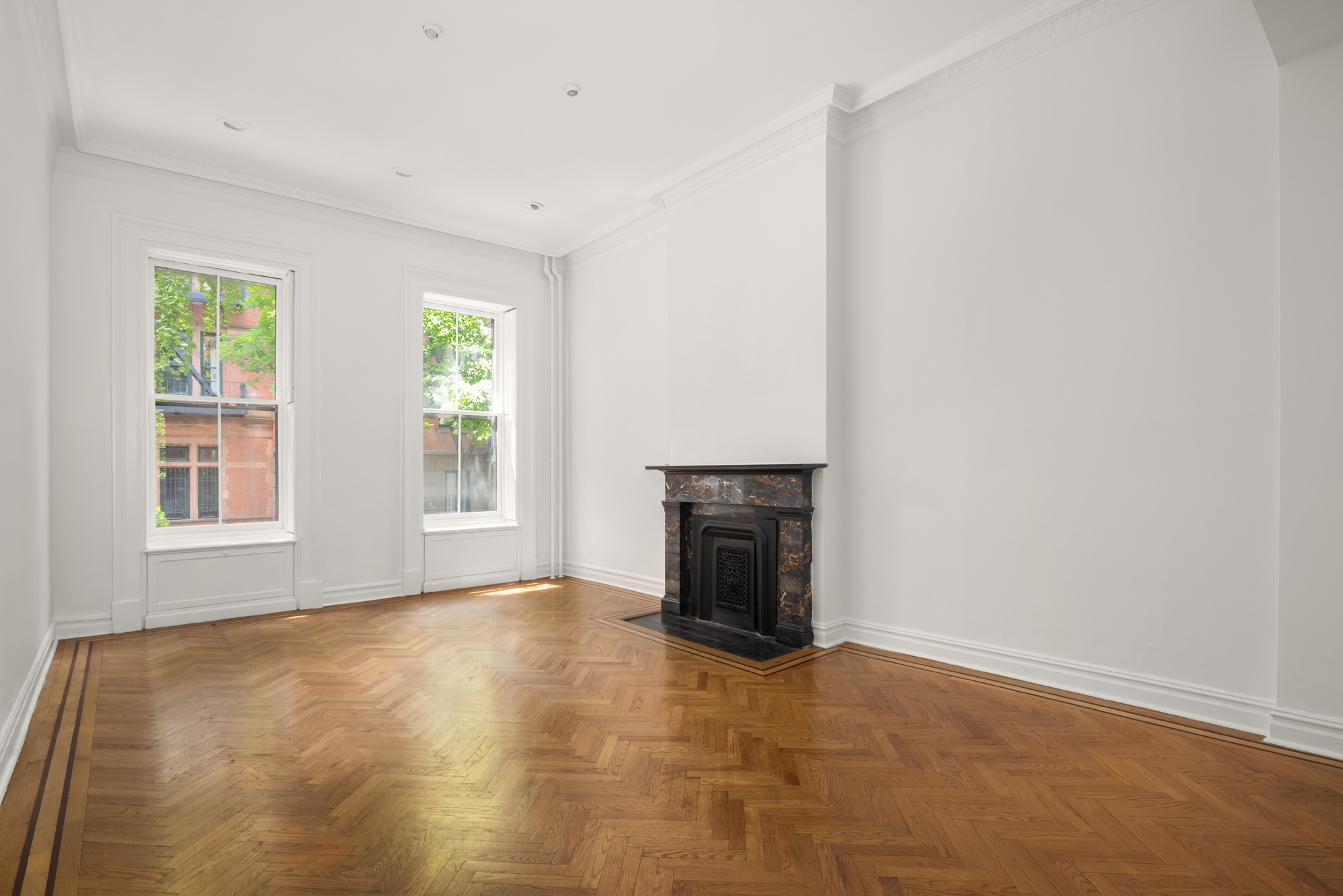 57 West 9th Street Manhattan, NY 10011 - Photo 2 of 11 an empty room with windows