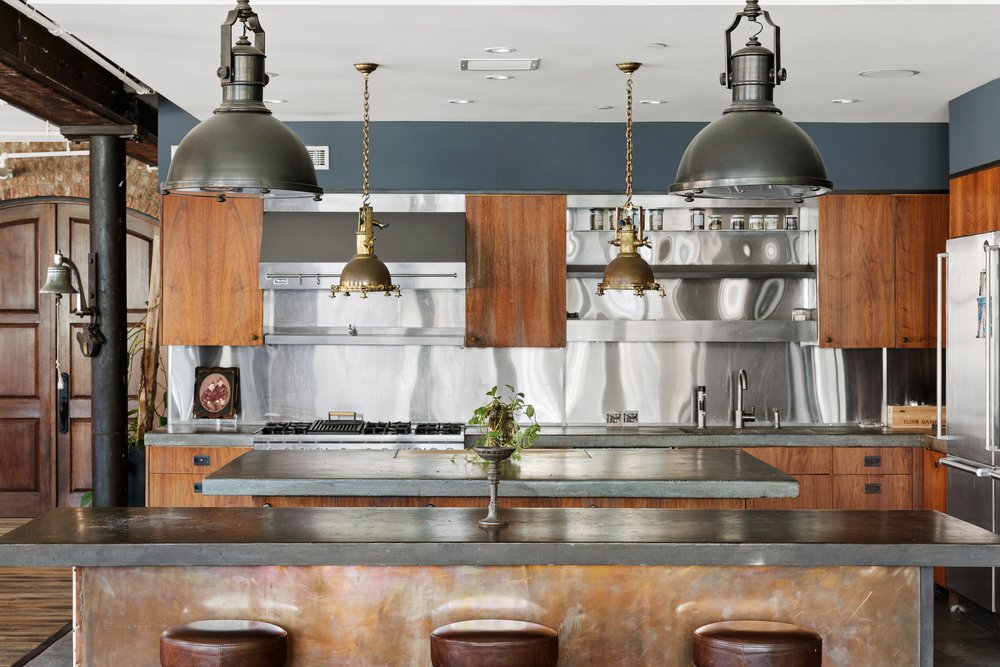 345 West 13th Street, Unit 2DEG Manhattan, NY 10014 - Photo 6 of 14 a kitchen with a refrigerator and chandelier