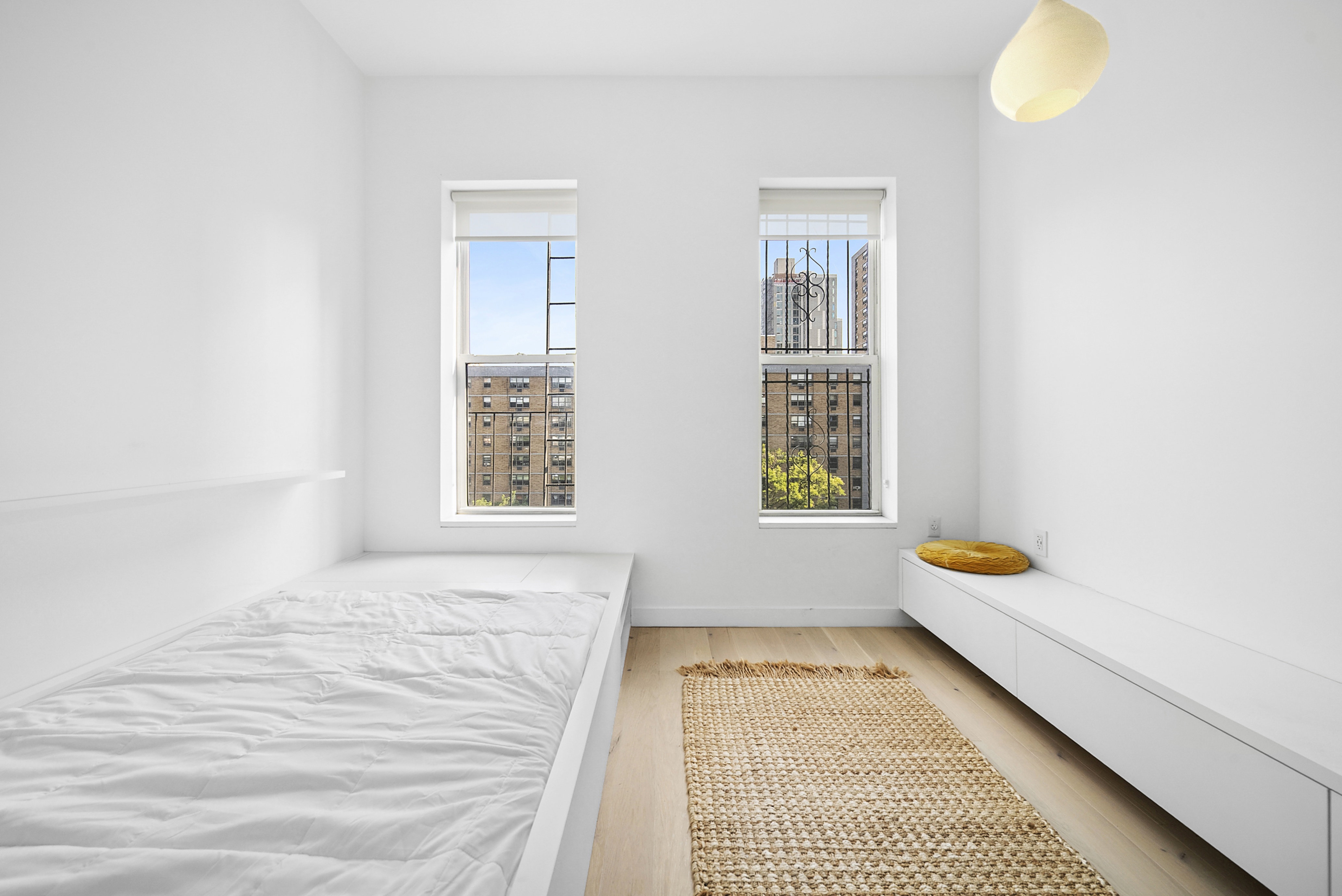 633 East 11th Street, Unit 24 Manhattan, NY 10009 - Photo 4 of 8 a bedroom with a bed and a window