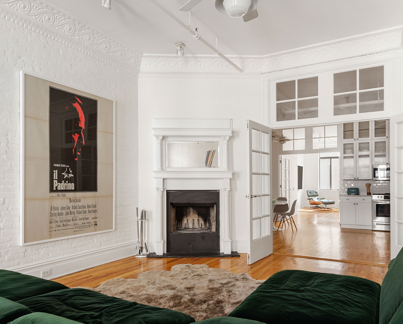 99 Reade Street, Unit 4E Manhattan, NY 10013 - Photo 2 of 11 a living room with furniture and a fireplace