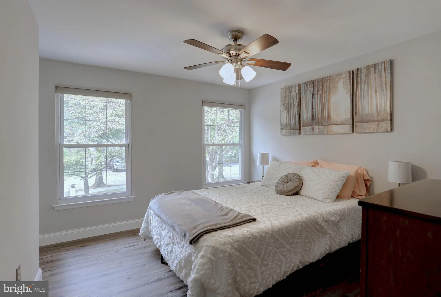 a bedroom with a bed and a television