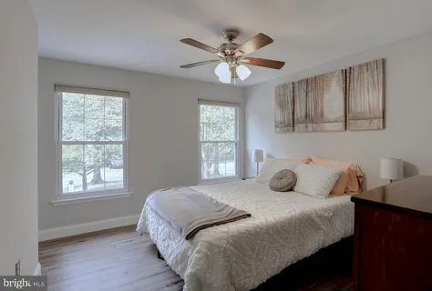 a bedroom with a bed and a television