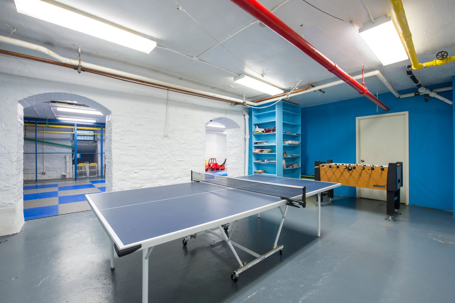 a kitchen with furniture and a table