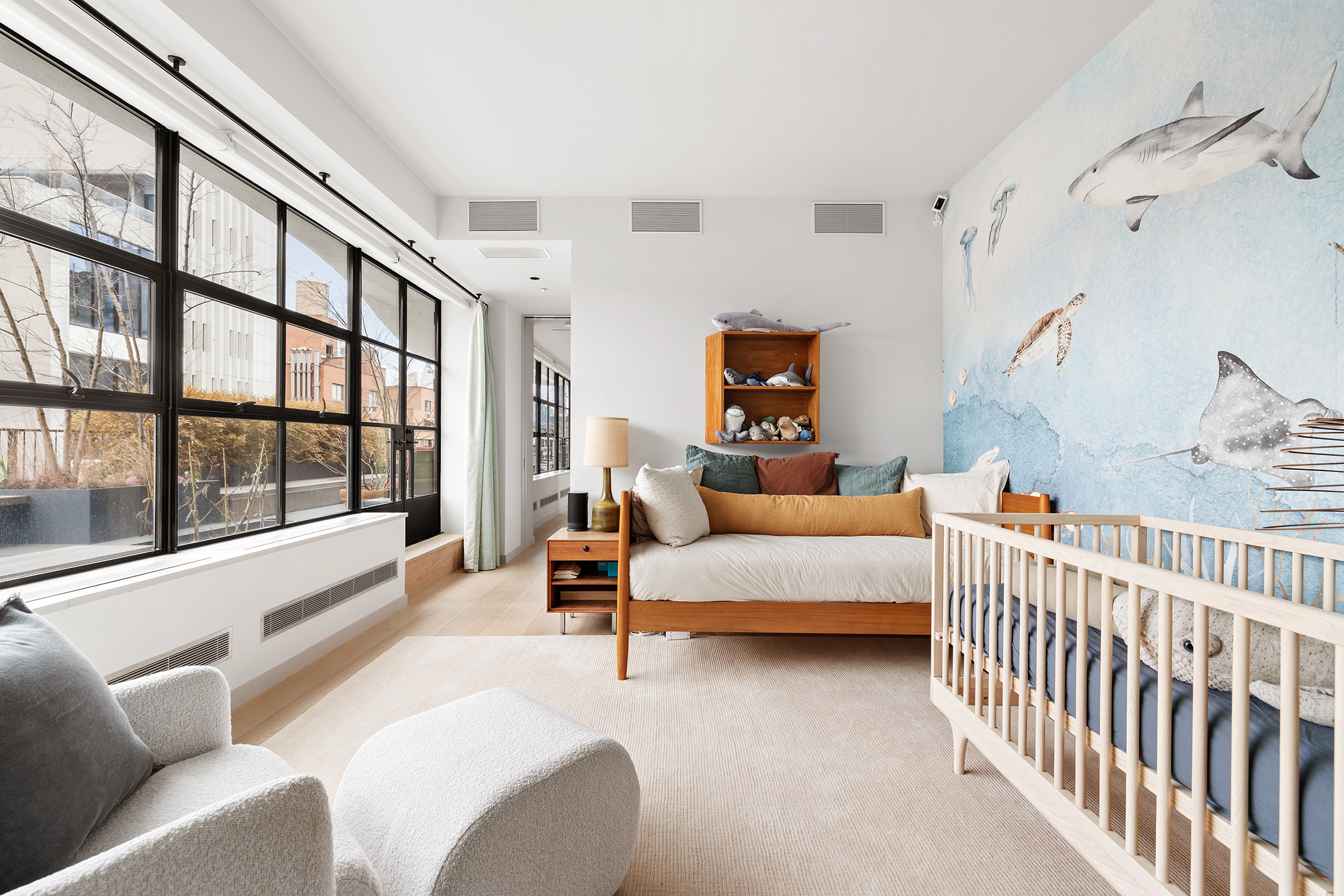 456 West 19th Street, Unit PHG Manhattan, NY 10011 - Photo 7 of 12 a bedroom with furniture and a large window