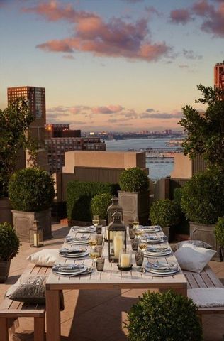 100 Barclay Street, Unit 13G Manhattan, NY 10007 - Photo 18 of 26 a view of a patio with chairs and table