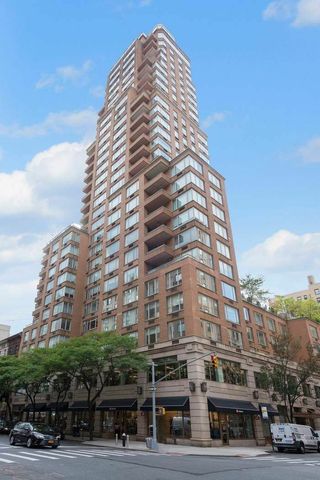 30 East 85th Street, Unit 8B Manhattan, NY 10028 - Photo 9 of 12 a view of a tall building next to a road