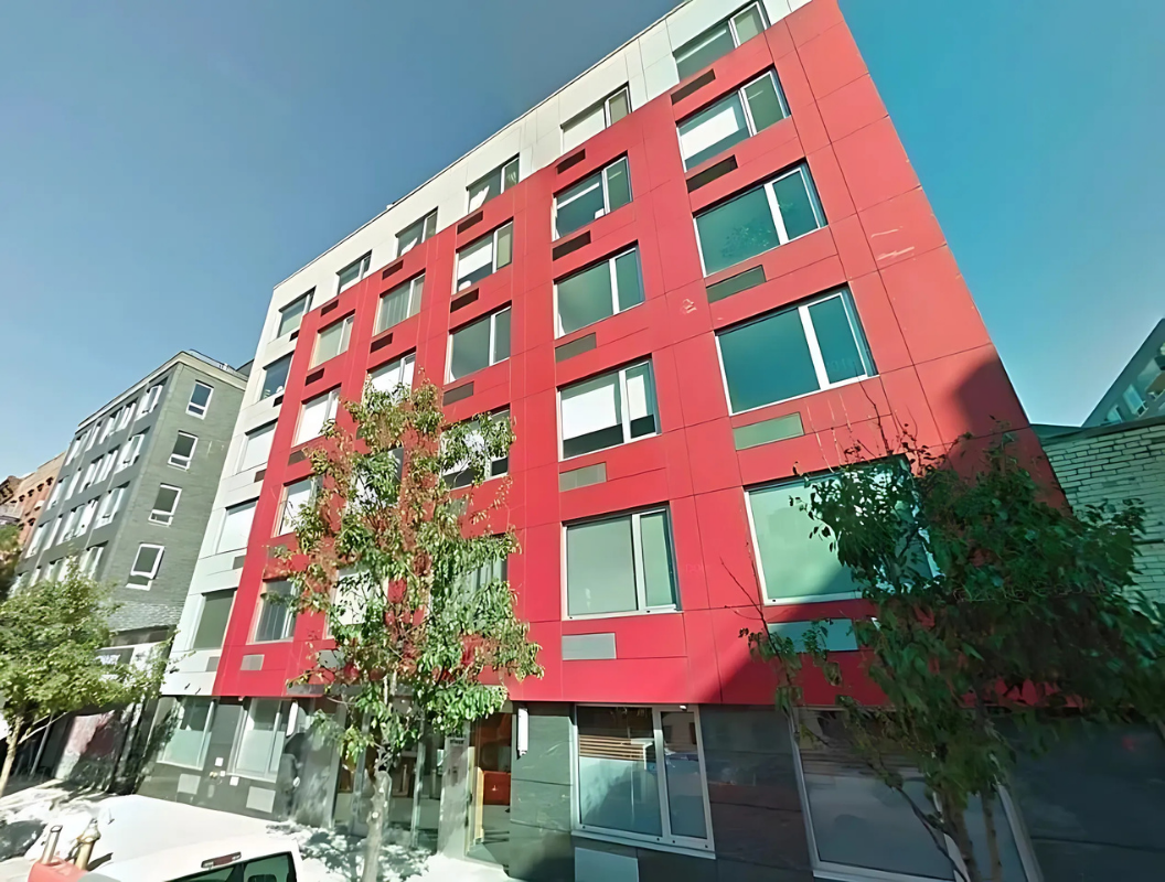 154 Attorney Street, Unit 304 Manhattan, NY 10002 - Photo 11 of 13 a view of building with yard and sitting area