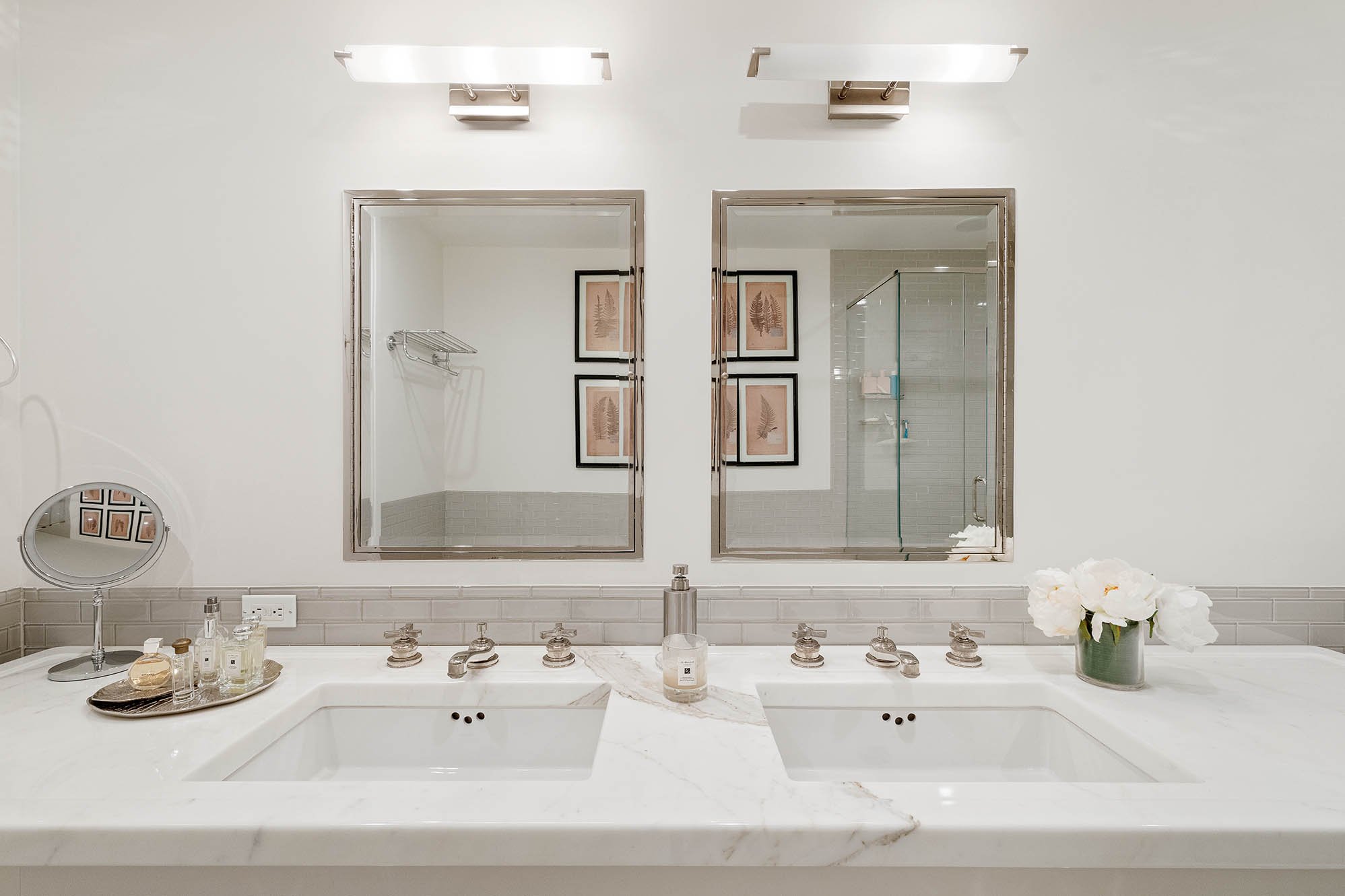545 West 110th Street, Unit PH11A Manhattan, NY 10025 - Photo 13 of 22 a bathroom with double vanity sinks and a mirror