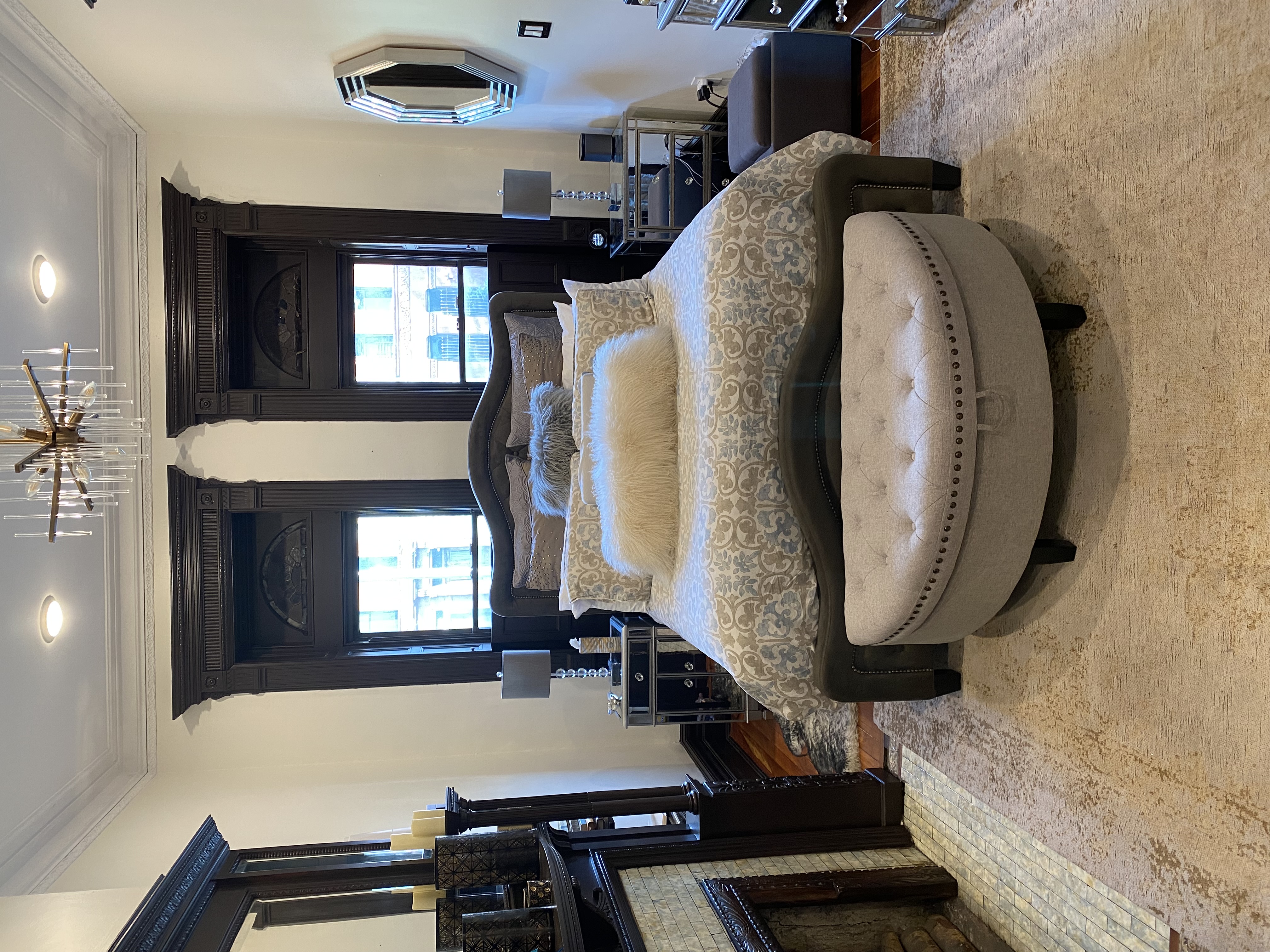 493 Decatur Street, Unit 1 Brooklyn, NY 11233 - Photo 6 of 26 a large bedroom with a bed and a fireplace