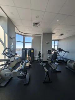 a room with lots of chairs and a projector screen