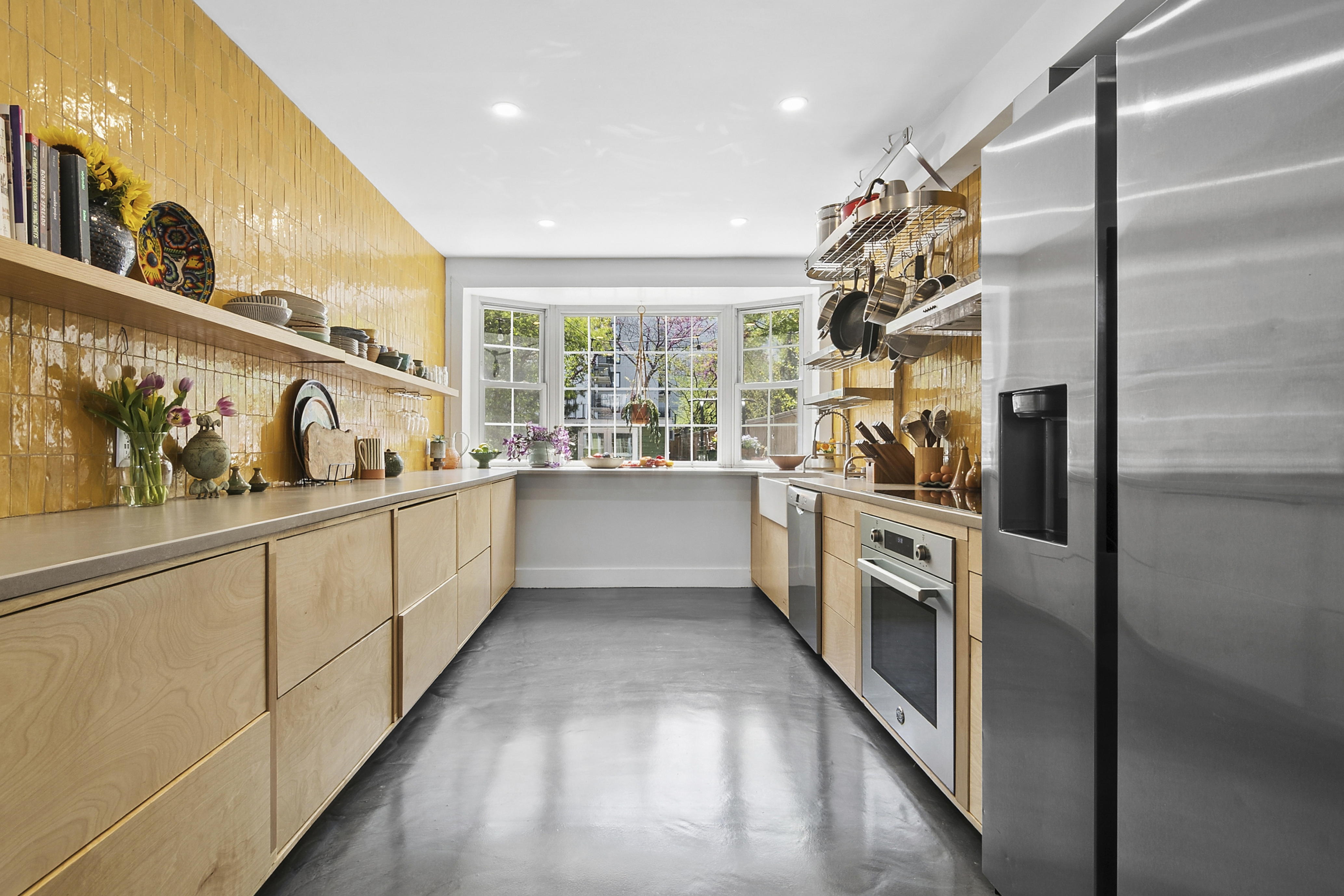 190 Concord Street Brooklyn, NY 11201 - Photo 2 of 14 a kitchen with stainless steel appliances a sink and cabinets