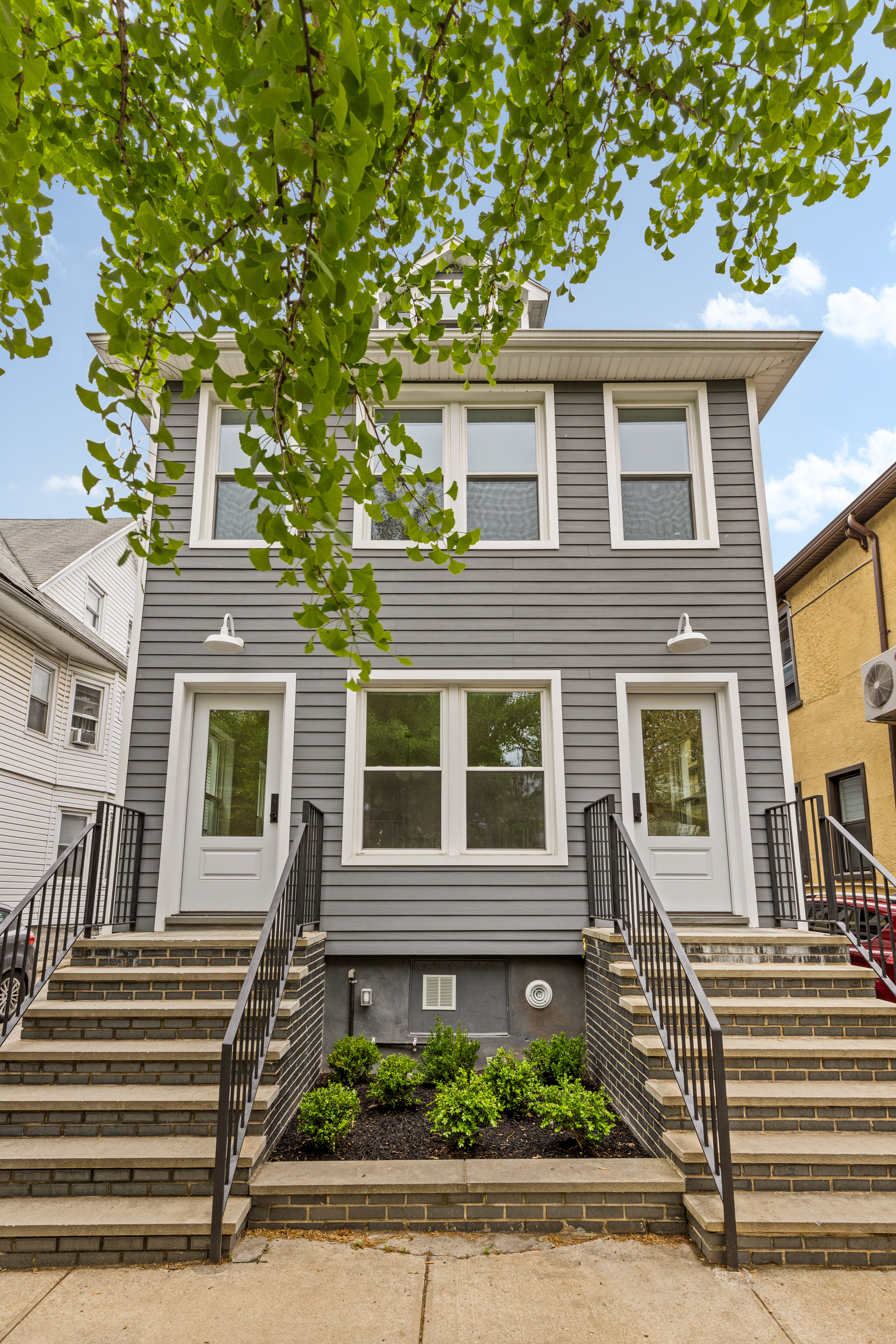 409 East 4th Street Brooklyn, NY 11218 - Photo 12 of 19 a front view of a house with a yard