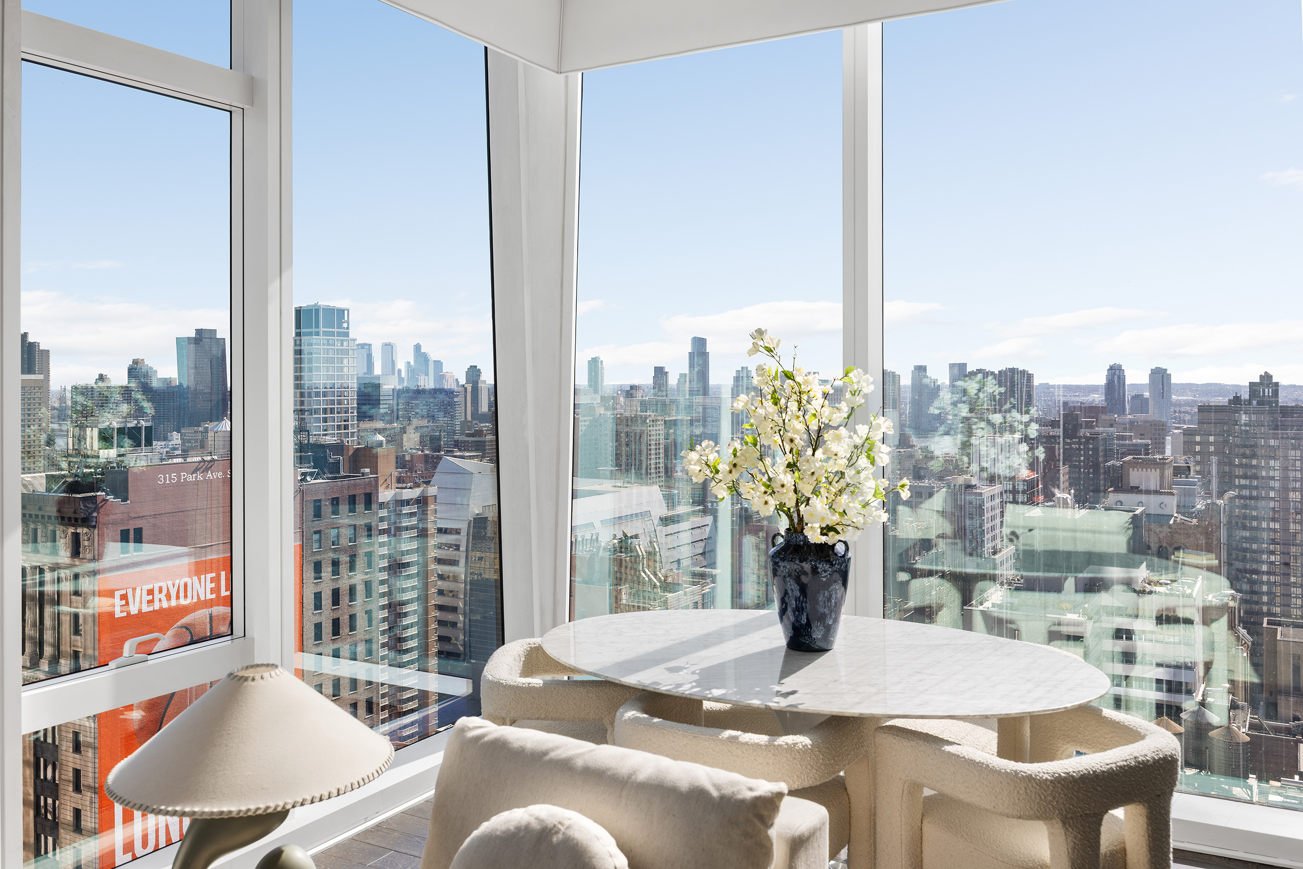 45 East 22nd Street, Unit 32B Manhattan, NY 10010 - Photo 17 of 36 a view of a dining room with furniture window and wooden floor