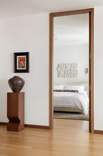 a room with furniture and painting on the wall