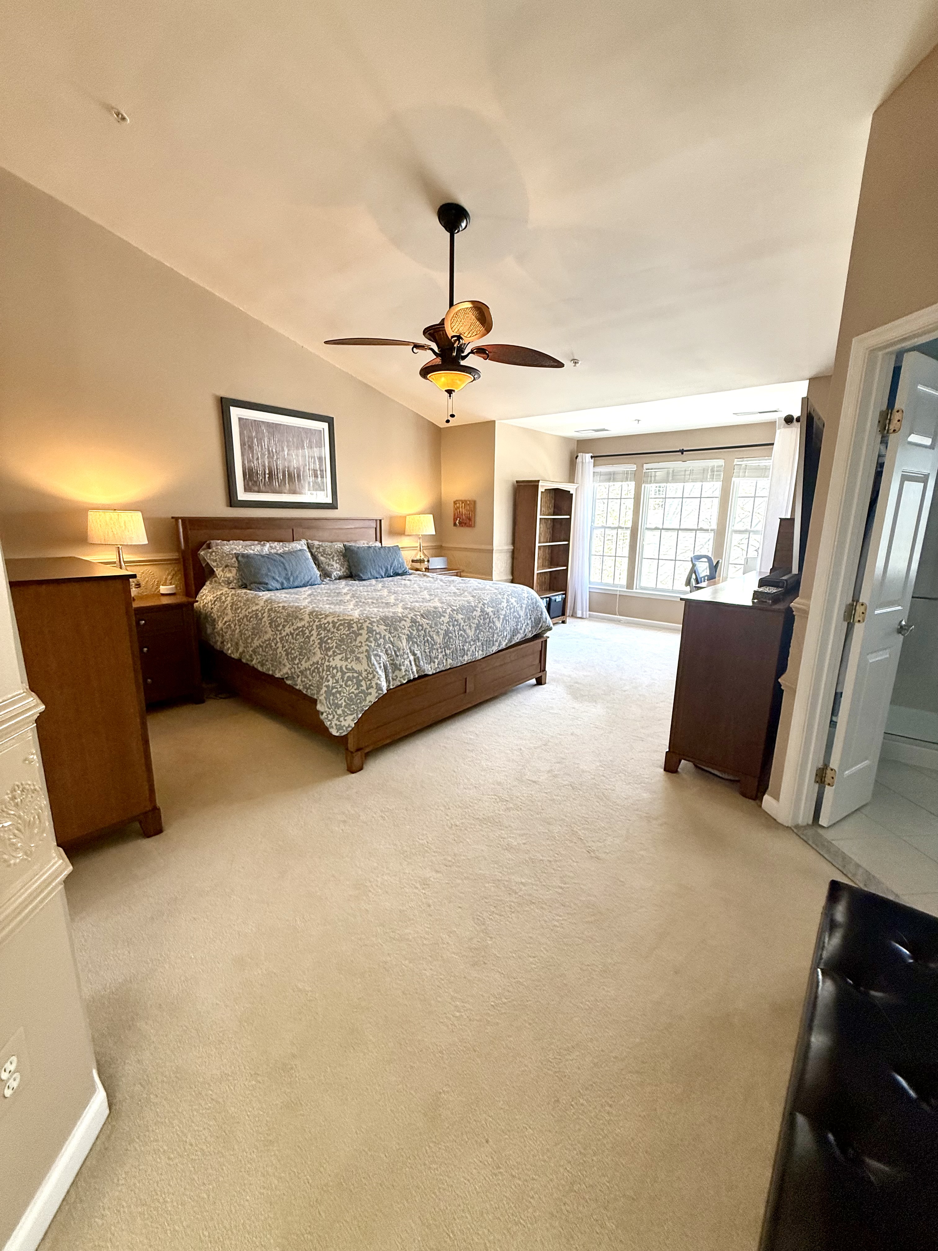 Address Upon Request Leesburg, VA 20176 - Photo 36 of 55 a bedroom with a large bed and a chandelier