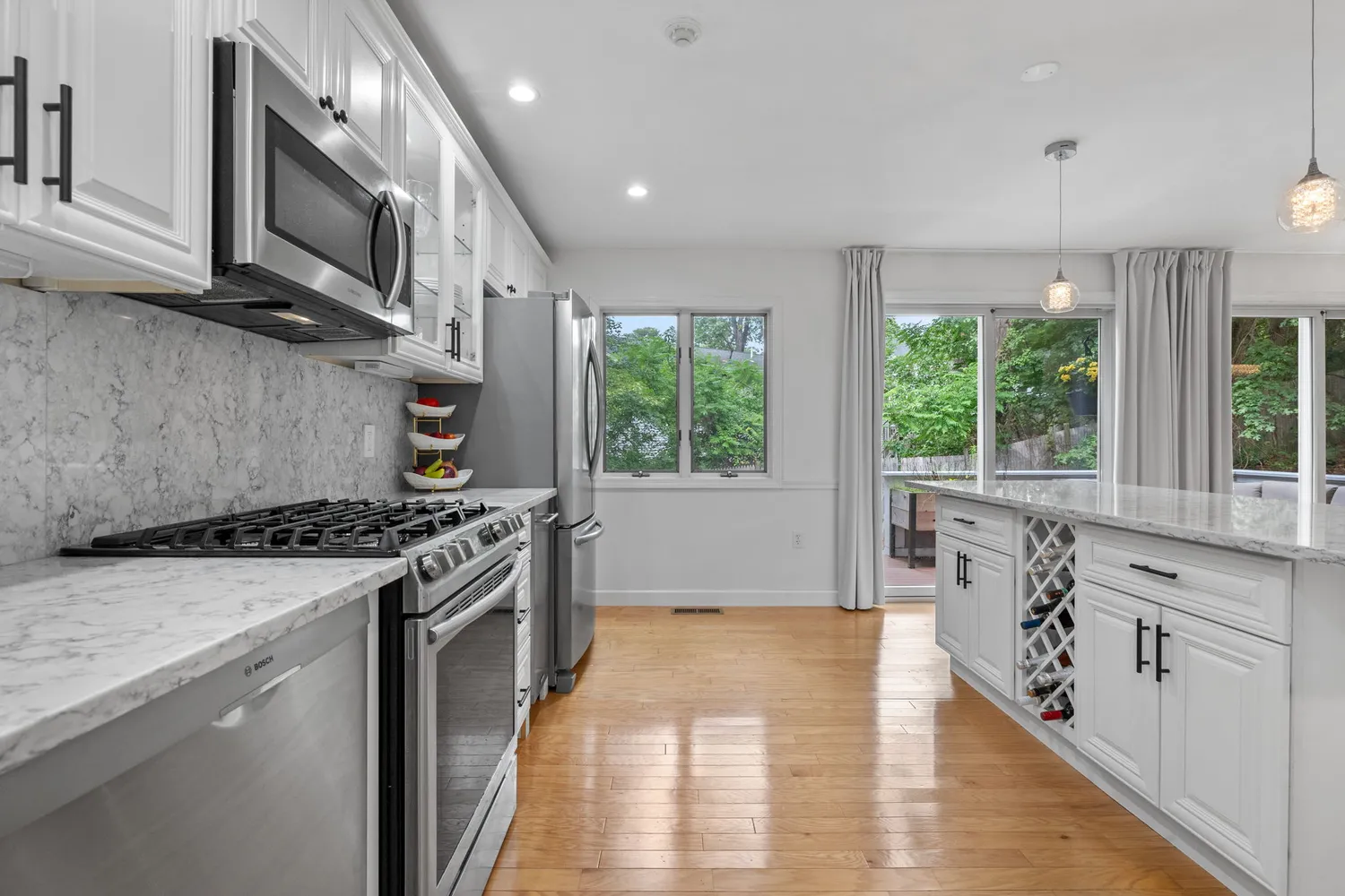 a kitchen with stainless steel appliances granite countertop a stove and a sink