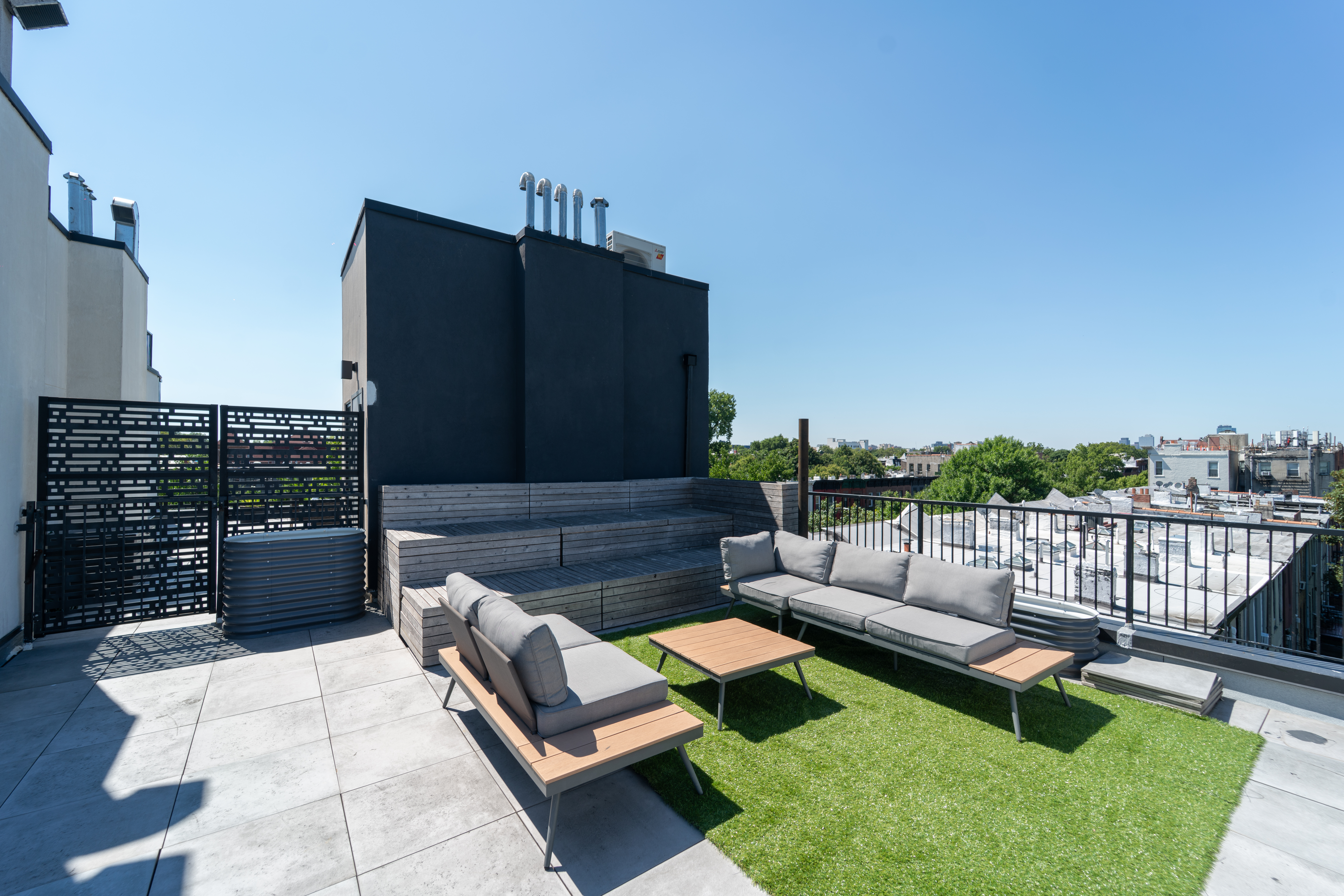 299 Van Buren Street, Unit 4C Brooklyn, NY 11221 - Photo 3 of 16 a view of a couches in the patio