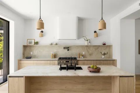a kitchen with sink and cabinets