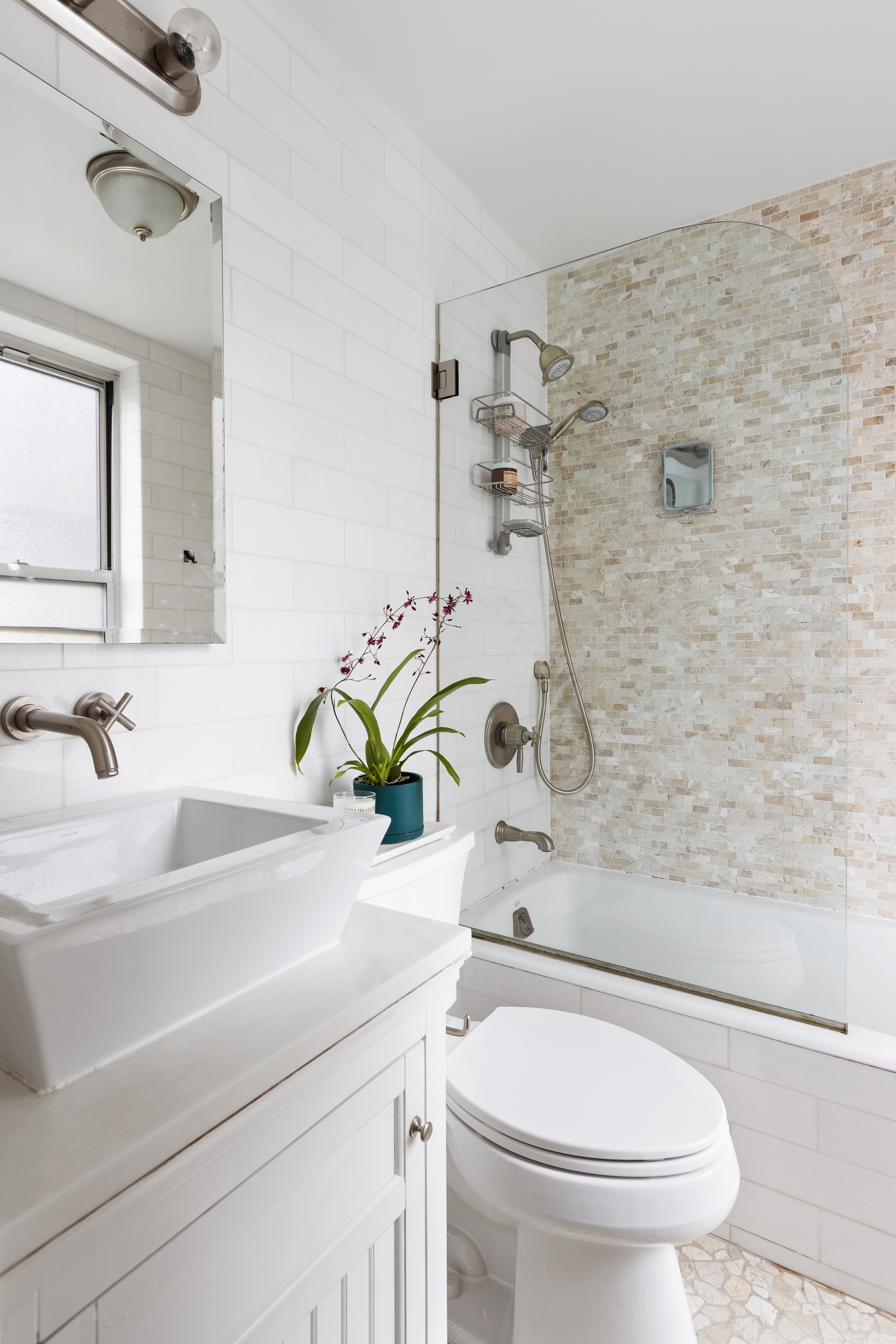 41 West 72nd Street, Unit 6B Manhattan, NY 10023 - Photo 5 of 7 a bathroom with a sink a toilet and shower